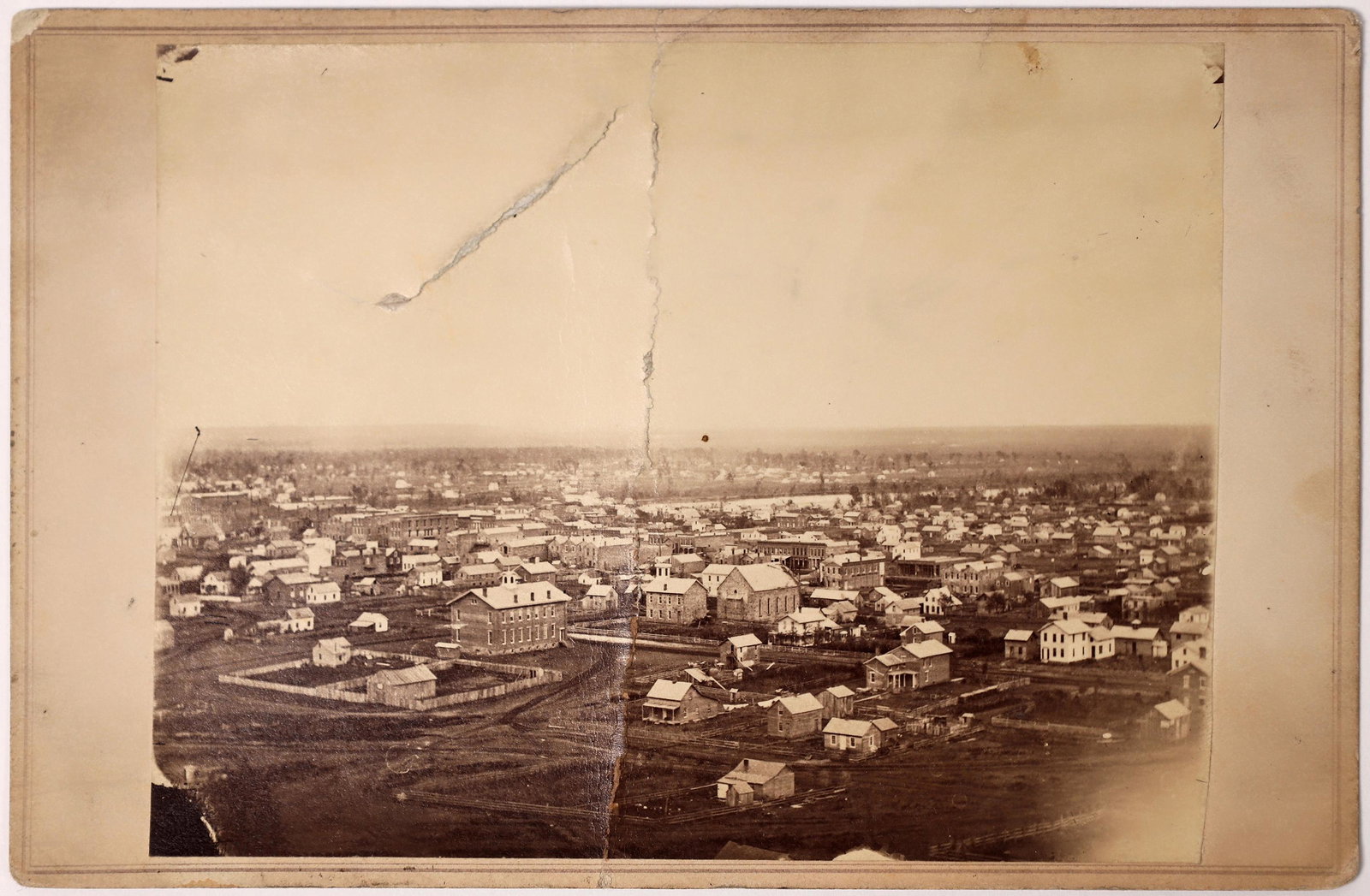 Lawrence, Kansas Photograph; c. 1880s-1900s [153560]: Birds' eye view photograph of the city of Lawrence, Kansas by the photograph artist, W.H. Lamon. This photograph was probably taken circa 1880s to 1900s. Approx. 6.5 x 4.25 inches. Good condition exce