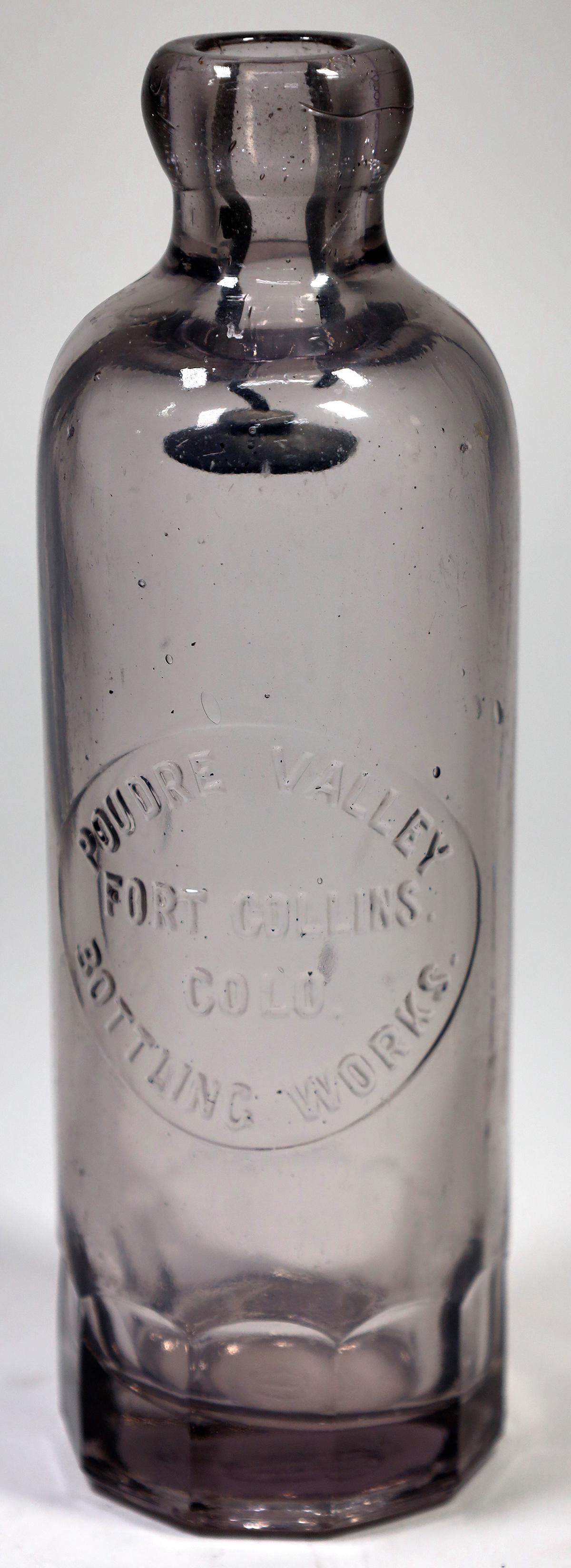 Fort Collins Poudre Valley Hutch Bottle [151629]: POUDRE VALLEY/FORT COLLINS COLO./BOTTLING WORKS. Fort Collins- Colorado's Craft Beer Capital! This Fort Collins, Colorado- Poudre Valley Bottling Works hutch bottle is purple in color, 7 1/2" tall, an