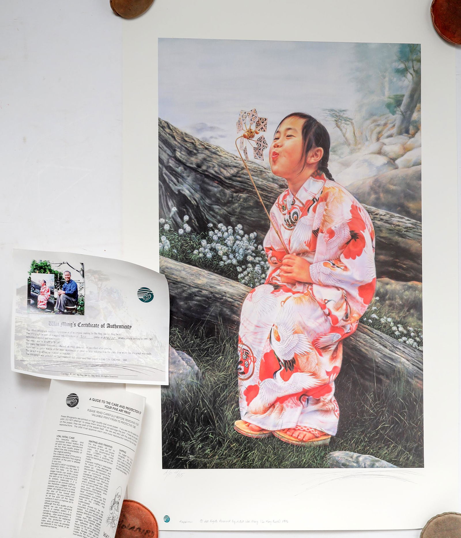 Happiness Poster by Ming [155961]: Happiness by Wai Ming. Nice poster of an Asian girl blowing a spinning wheel. Artist proof 4/35 with COA. 35x24".Date: Country (if not USA): State: City: Provenance: