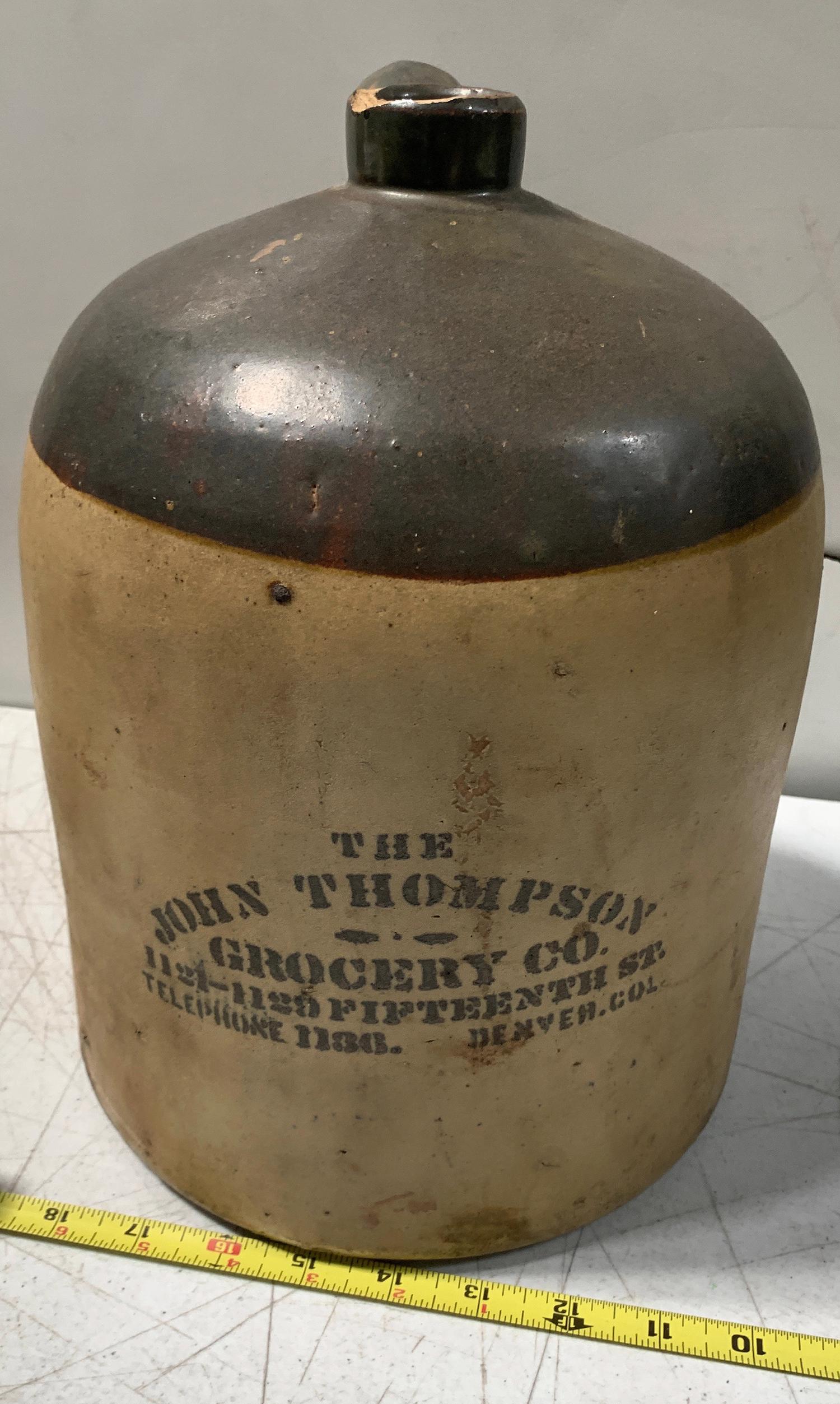 John Thompson Grocery Co. Jug [154898]: Preble J-130. Prominent lip chip. 12" tall, 9" diameter. Date: Country (if not USA): State: Colorado City: Denver Provenance: Gary Bracken Collection