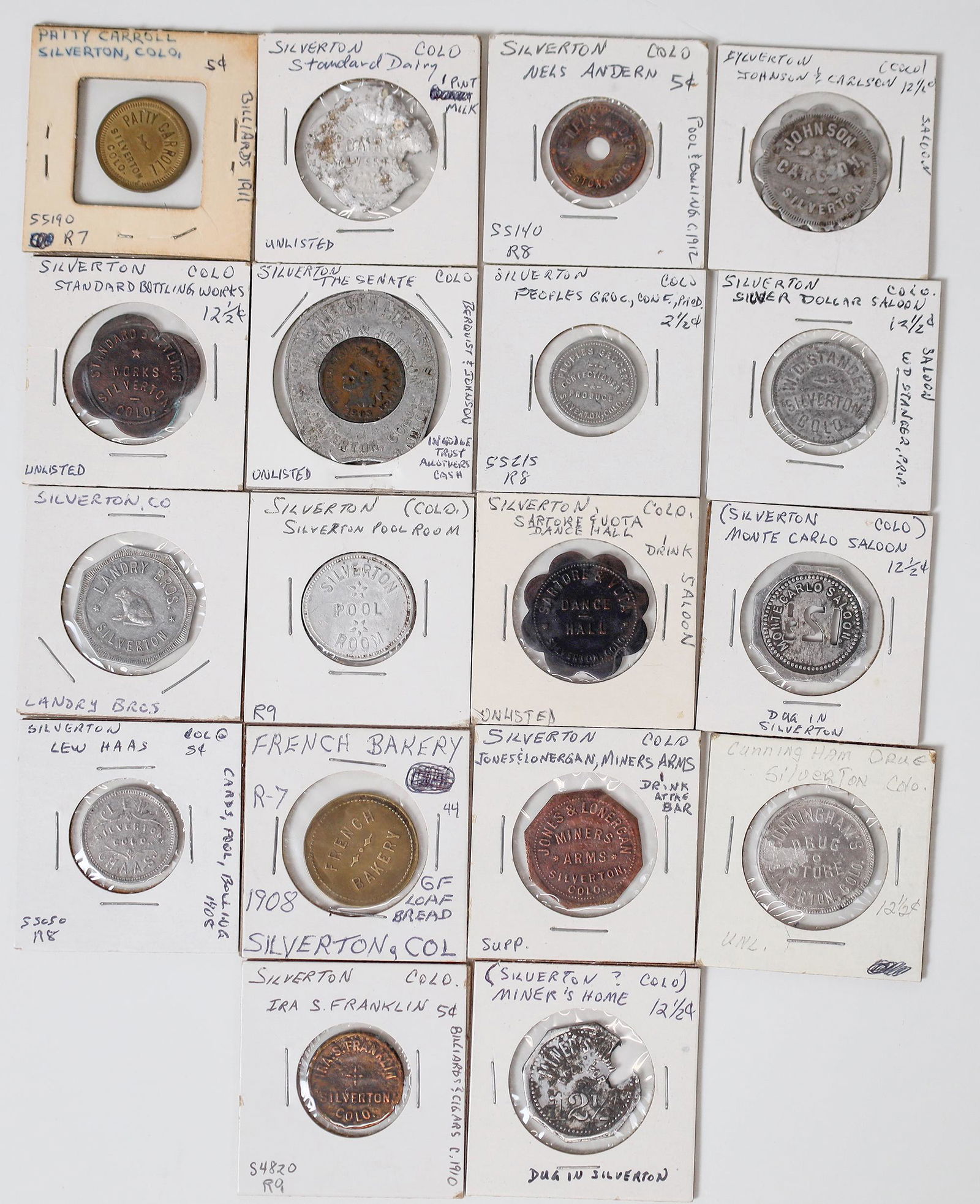 Silverton Token Collection (18) [159297]: Lot of eighteen tokens from the San Juan County town of Silverton. Standard Bottling Works; Patty Carroll; Nels Andern; Standard Dairy; Cunningham Drug; Ira S. Franklin; French Bakery; Lew Haas; Johns