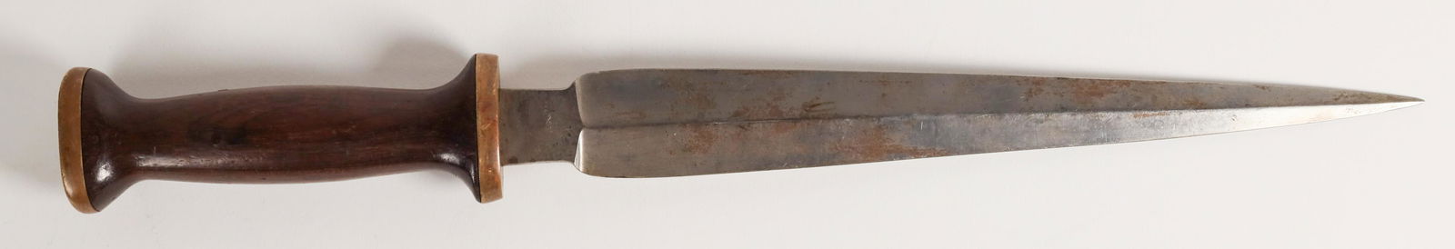 Pampa Real Knife Dagger [161254]: This dagger blade knife is 17 in. overall length, with a 12 in. blade. It is marked "I. Wilson Pattern only/ REAL (logo) KNIFE/ PAMPA". Some light patination. PAMPA on the ricasso on both sides. Walnu