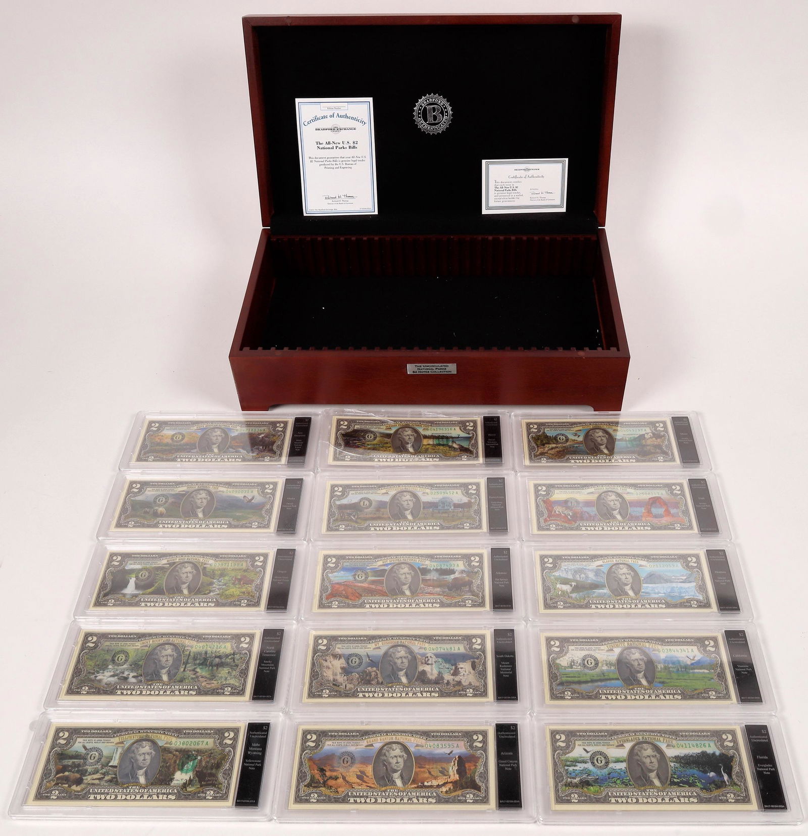 U. S. Two Dollar Bills National Parks [163492]: Issued by Bradford Exchange Mint. The Uncirculated National Parks $2 Notes Collection. 15 crisp uncirculated $2 Federal Reserve Notes, each commemorating one of America's national parks. Denali, Everg