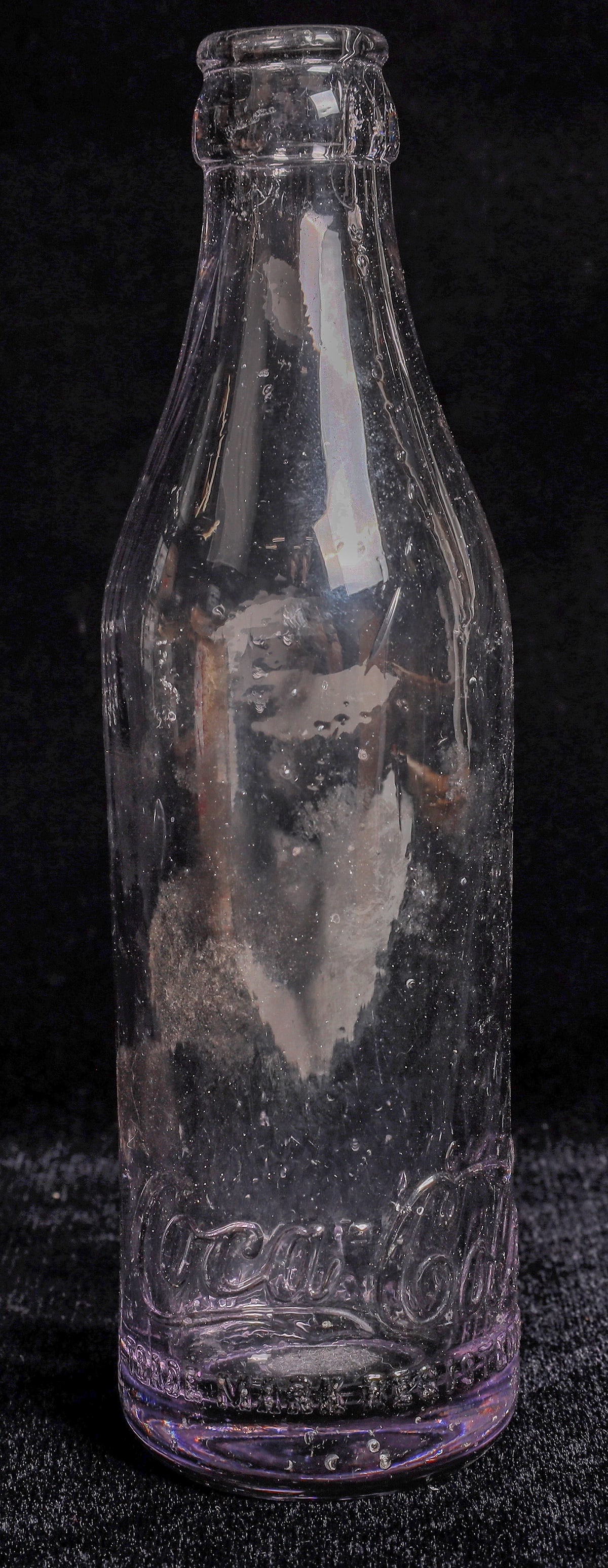 Mangum Coca Cola Crown Top Bottle [169027]: Clear crown top Coca Cola bottle, Mangum, Oklahoma. No apparent chips or cracks. Light base dings. Mangum Oklahoma
