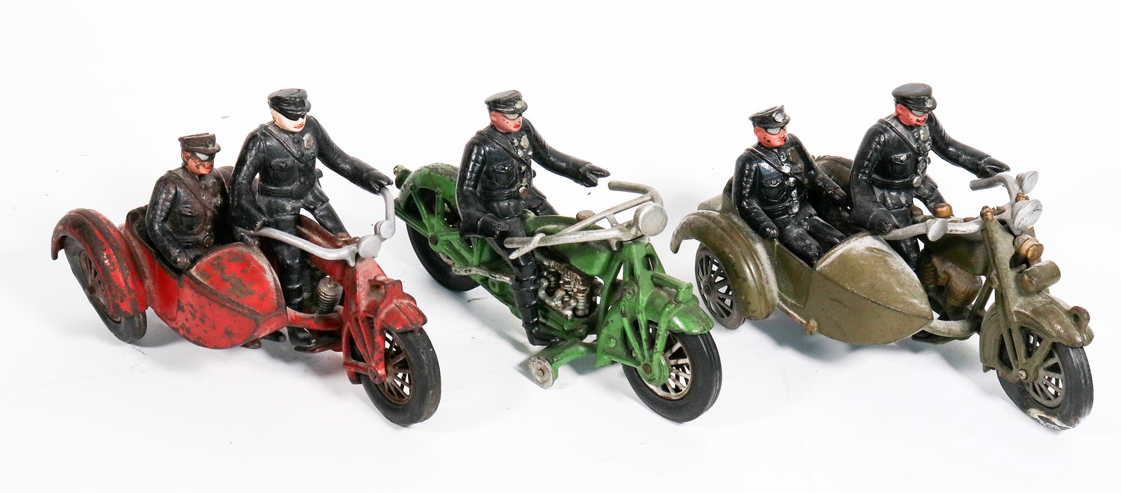 Hubley Sidecar and Single Rider Cast Iron Motorcycles [170284]: Lot of 3. !. Two Harley Davidson sidecar police motorcycles w/Rider and passenger Both have decals on tank, but one is partially gone. They have wear on the paint, both have rubber tires (one is missi