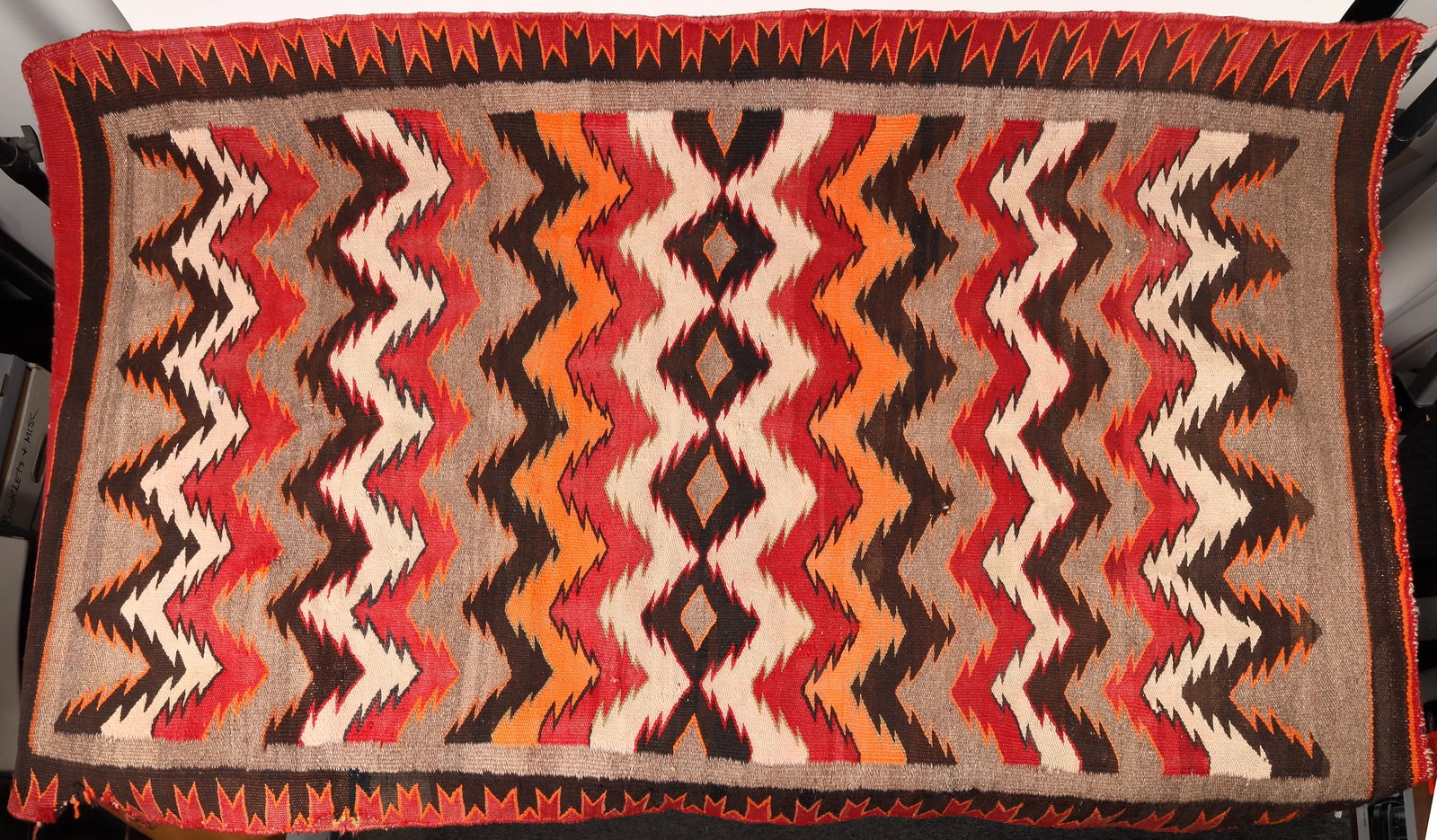 Navajo Red Mesa Blanket 1900s [172238]: A Red Mesa Navajo blanket that measures about 40"x 56". There is slight unraveling at one part of the border, an easy repair. Red Mesa blankets signaled the transition of Navajo weavers from blankets 