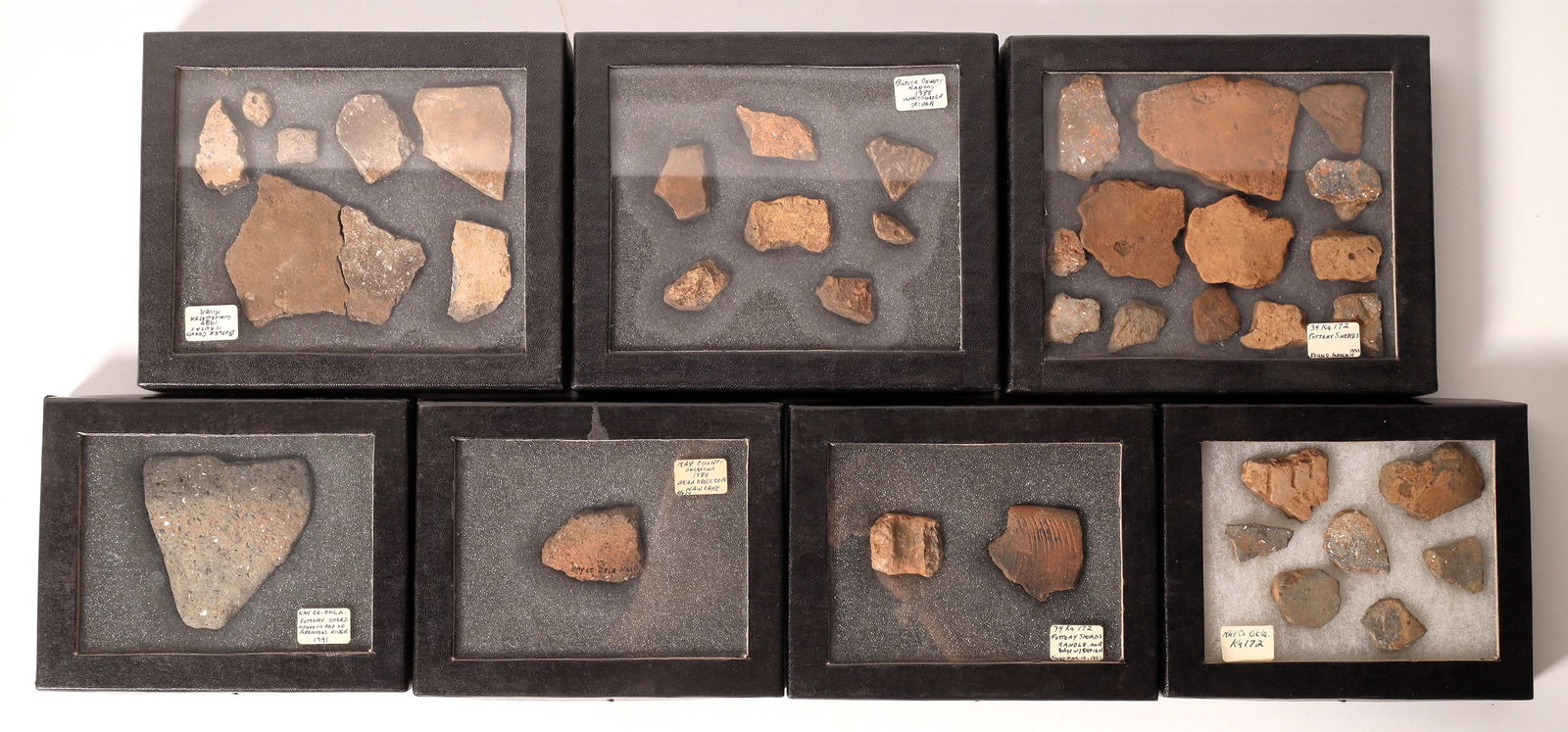 Pottery Chards From Kansas and Oklahoma [175762]: These are seven riker boxes of pottery shards from Butler County, Kansas and from Kay County, Oklahoma; they're not far apart. Most pieces are non-decorative indicating fully functional pottery while