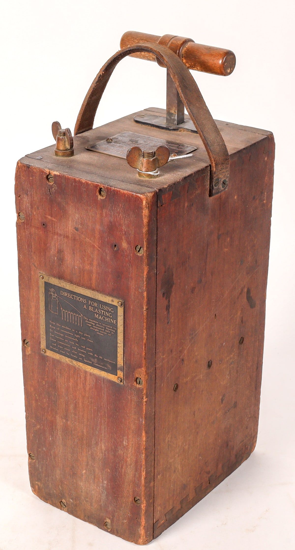 DuPont #20 Blasting Machine [173725]: DuPont No. 20 Blasting Machine, fires 1-20 electrical blasting caps. Serial no. 2A802. Two brass plaques, one with name and info (top) and the other on front side stating instructions. Leather strap i