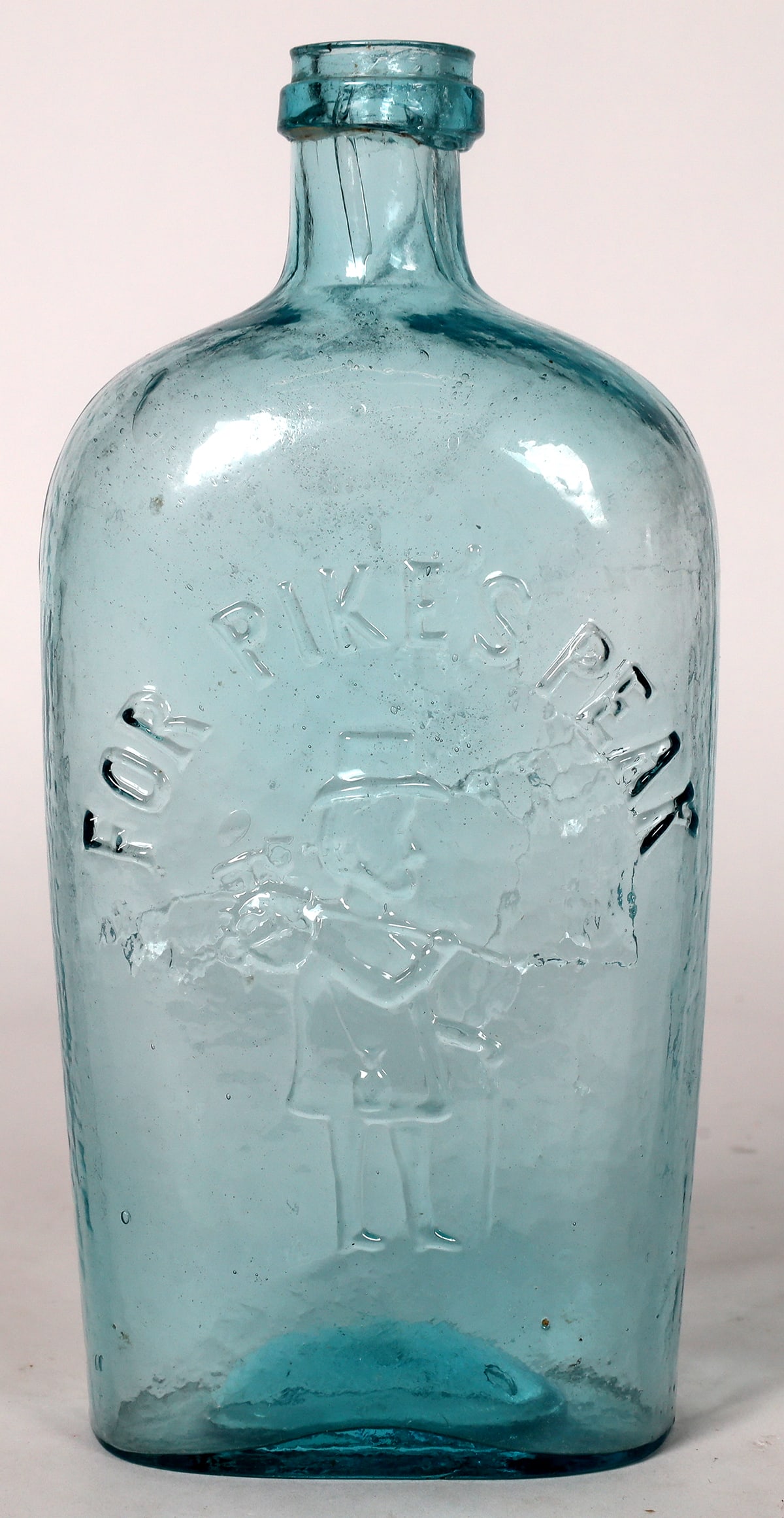 Pikes Peak Quart Flask, GX1-47/48 [173507]: Pikes Peak Quart Flask, GX1-47/48, aqua problem free applied chollar lip, minor facing right on obverse, man shooting deer on reverse. 9" tall. The Pikes peak flasks are popular among collectors for o