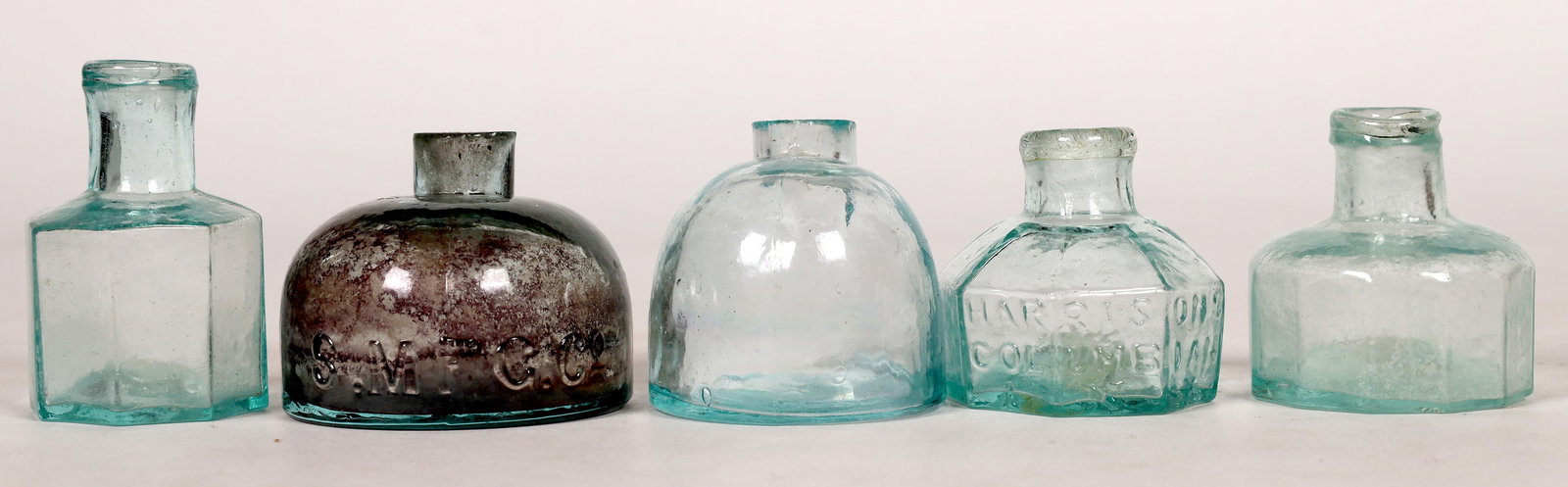 Aqua Ink Collection (5) [172329]: 1.) Light green aqua Round turtle style sheared top S. Mfc co. at base flat bottom 2.) Aqua turtle style unembossed 1 7/8" diam also sheared top 3.)12 sided 1 7/8" tall 1 3/4" diam light aqua. open po