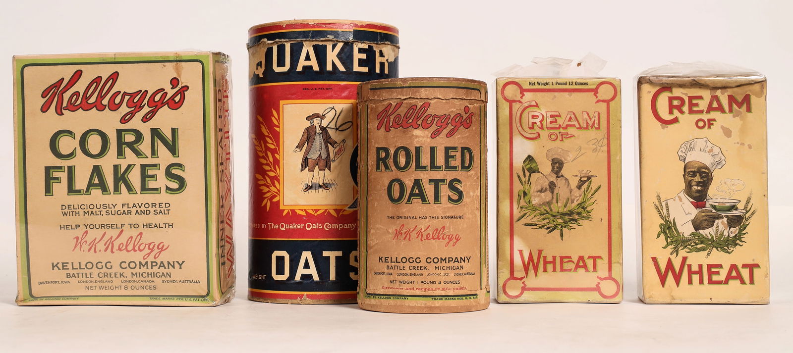 Cereal Containers [175234]: Cereal Boxes from the early 1900s, including two (2) Cream of Wheat (one pound, 12 ounce), Kellogg's Rolled Oats (one pound, four ounce), a three pound Quaker Oats drum and an eight ounce Kellogg's Co