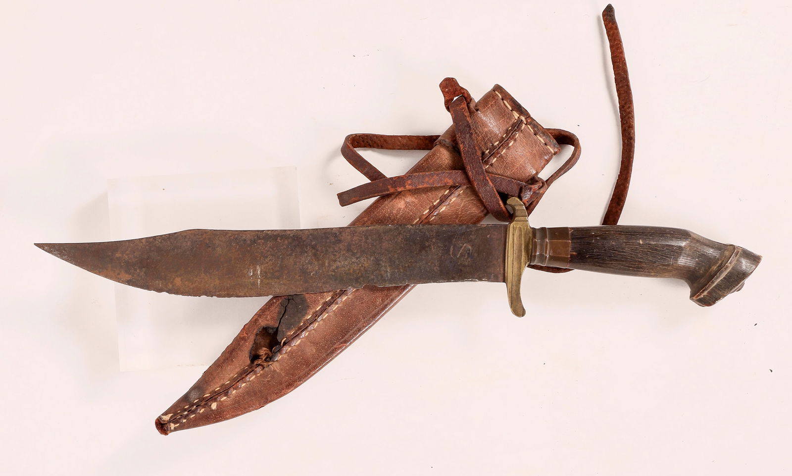 Bowie Knife-Handmade, WWII Saipan [179210]: This Bowie knife is handmade at 12 in. with a 7 in. blade. The guard is solid brass, a full length tang and buffalo horn grips. The edge is worn and rough, made in Saipan in the Mariana Islands during