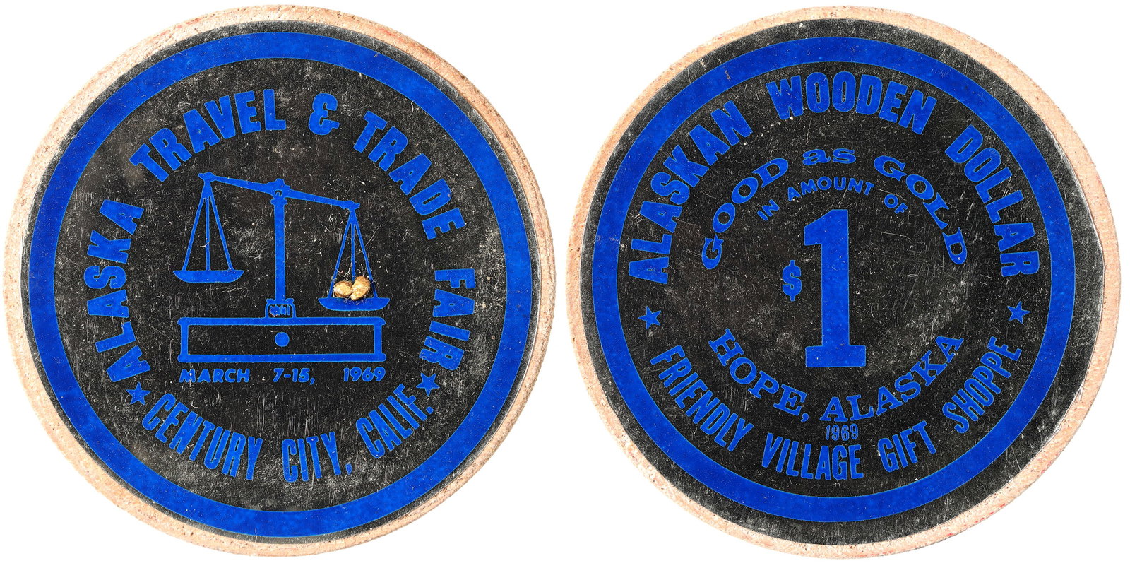 Alaskan Wooden Dollar & Gold Nuggets 1969 [178473]: Token catalog notes most surviving examples are missing the tiny gold nuggets on the scale on the reverse, but this one has two tiny nuggets: ALASKAN WOODEN DOLLAR / GOOD AS GOLD / IN AMOUNT OF / $1 /