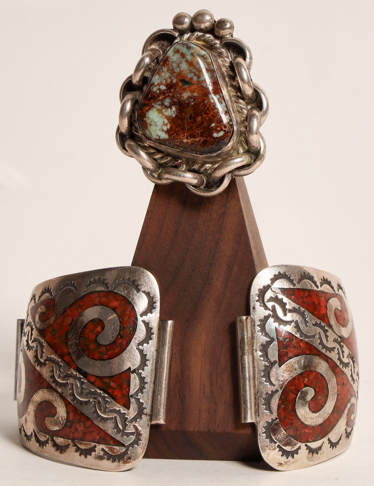 Watch Band and Ring [162680]: Watch band features crushed coral inlaid in etched silver. Elegant design. Hallmarked "J.W.". Unusual ring is set with possibly Pilot Mountain turquoise. Silver chain design around stone. From Frank L