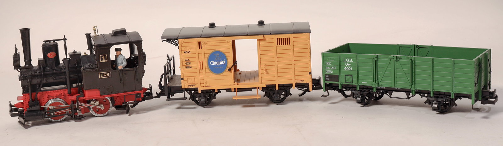 G Scale Lehmann 0-4-0-LGB #1 Switcher w/Rolling Stock (3) [185763]: Lot of 3. Lehmann 0-4-0 #1 loco engineer in cab and box car and gondola, G Scale. Cond C8. Never run always on display. Untested. [