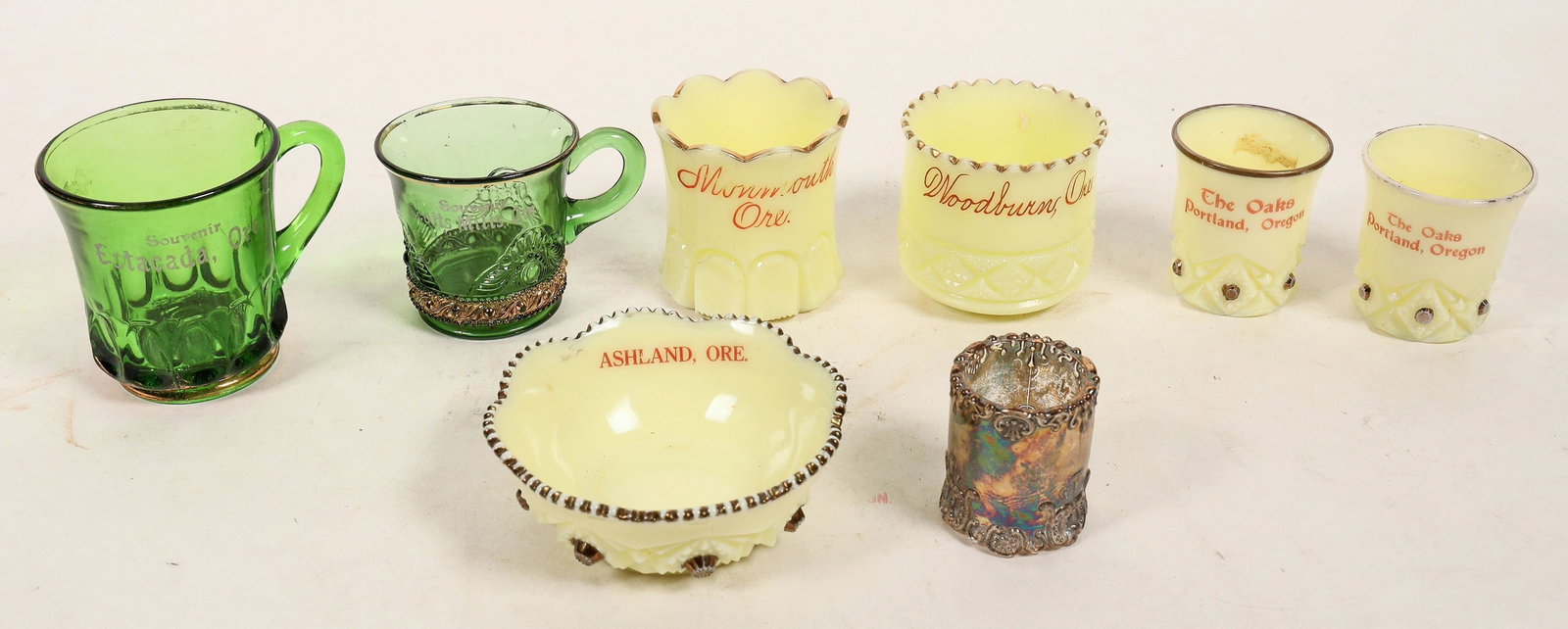 Oregon Souvenir Glassware (8) [191455]: Souvenir glasses from various Oregon cities. They come in an assortment of colors and designs, including green, rainbow, yellow cream and jeweled. All are in nice condition. Please see photos for more