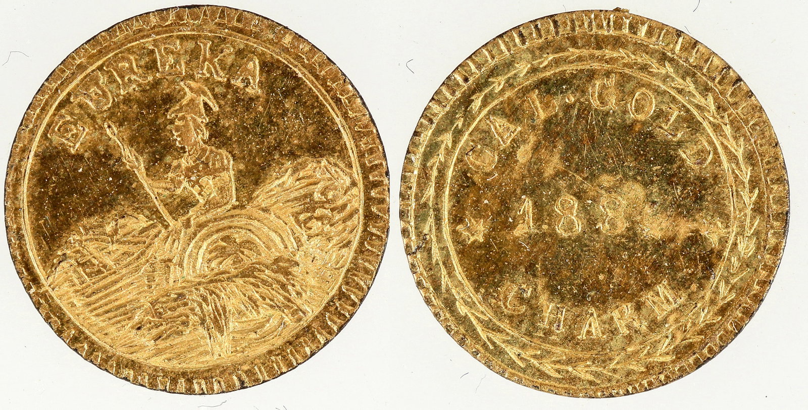 1884 Cal Gold Charm Kroll Hoard [193048]: Period Three issue: Cal Gold / 1884 / Charm // Eureka / Minerva seated. 10 mm; 0.1 gram, AU-BU condition.[]Date: Country (if not USA): State: City: Provenance: