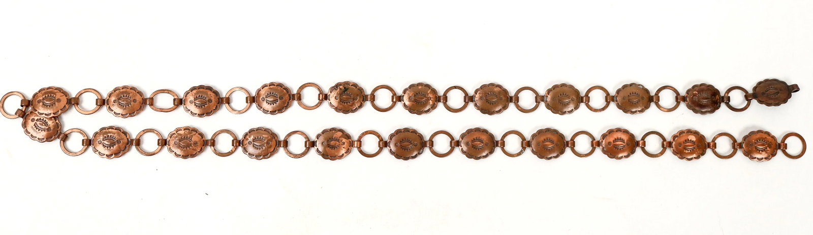 Copper Waist Band [193878]: A 30" copper concho waist band, mostly likely from Bisbee, AZ or Chino, NM.^Date: Country(if not USA): State: City: Provenance: