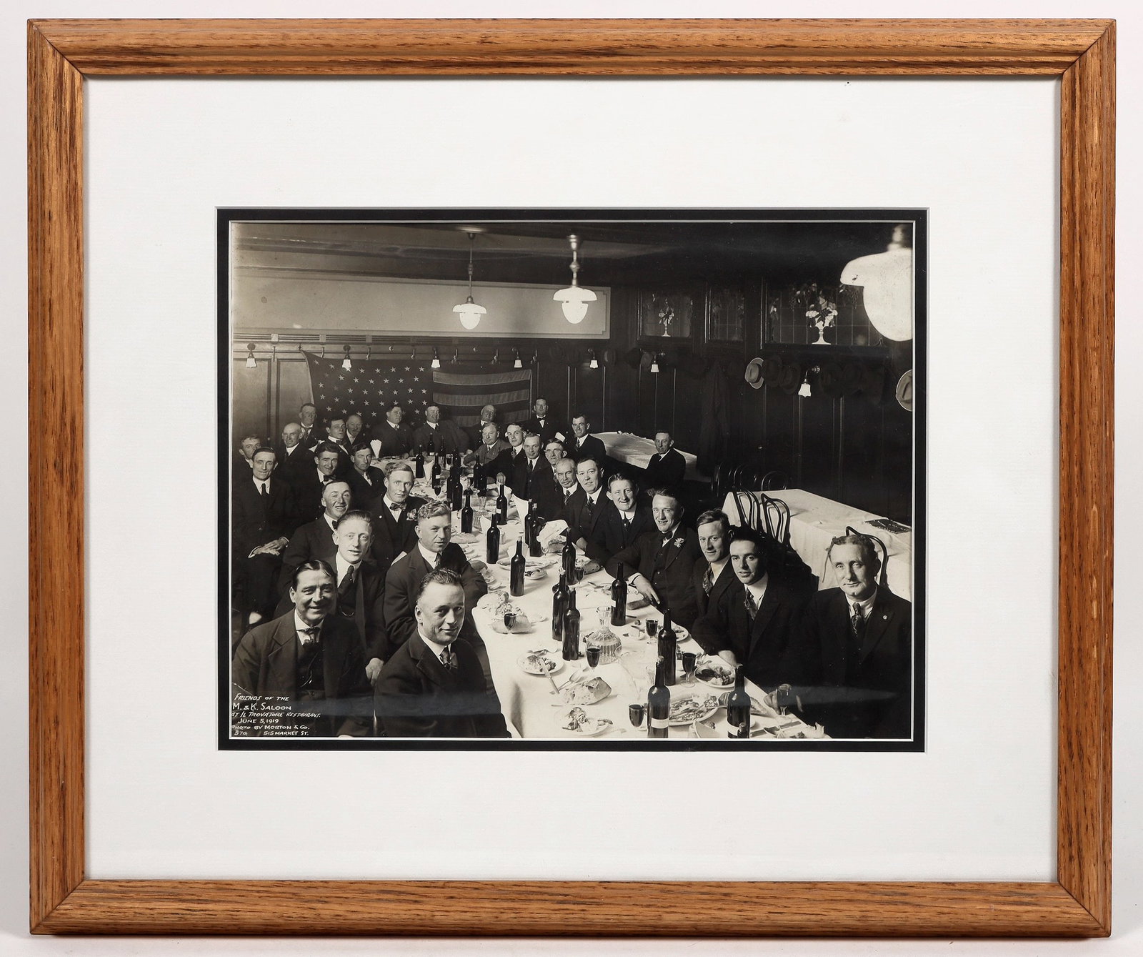 Vintage San Francisco Saloon Photograph [194915]: Framed and matted photo from Morton Photography, taken at The M&K Saloon/Il Trovatorre Restaurant in 1919. (21 x 18 inches). The title is "The Friends of the M&K Saloon. It was located at 515 Market S
