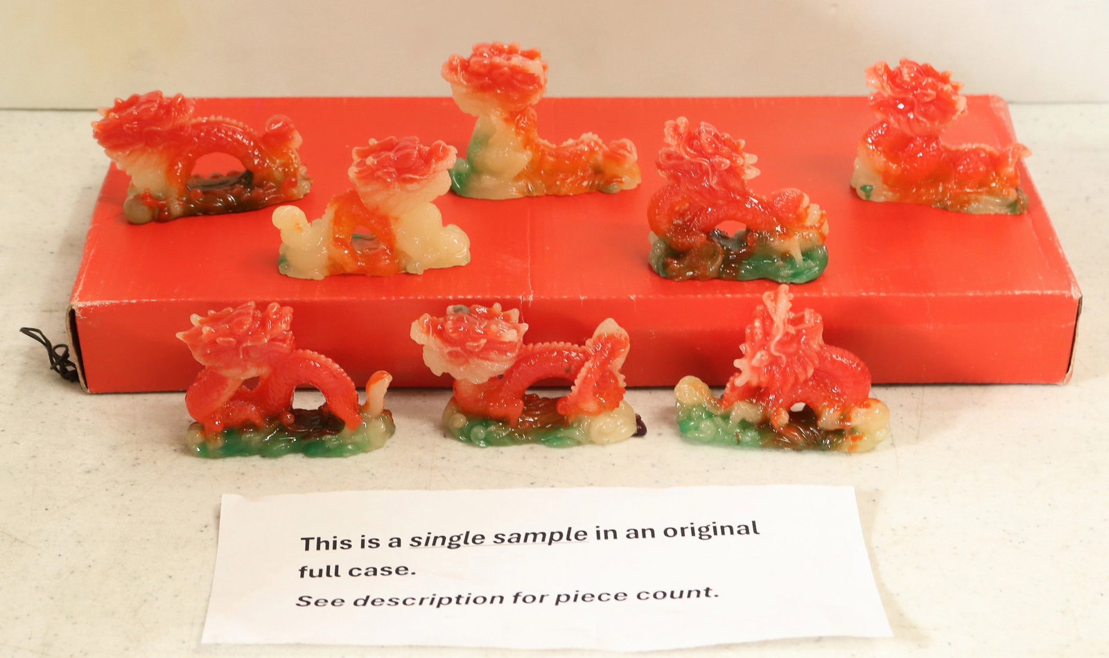 Resin Colored Dragon 8 Packs, 12 Sets [195775]: 12x multi colored Resin dragon sets of 8, 2.25x3". In original boxes. These items have been in storage for 20 years and have not been inspected. Sold as is.^Date: Country (if not USA):State: City: Pro