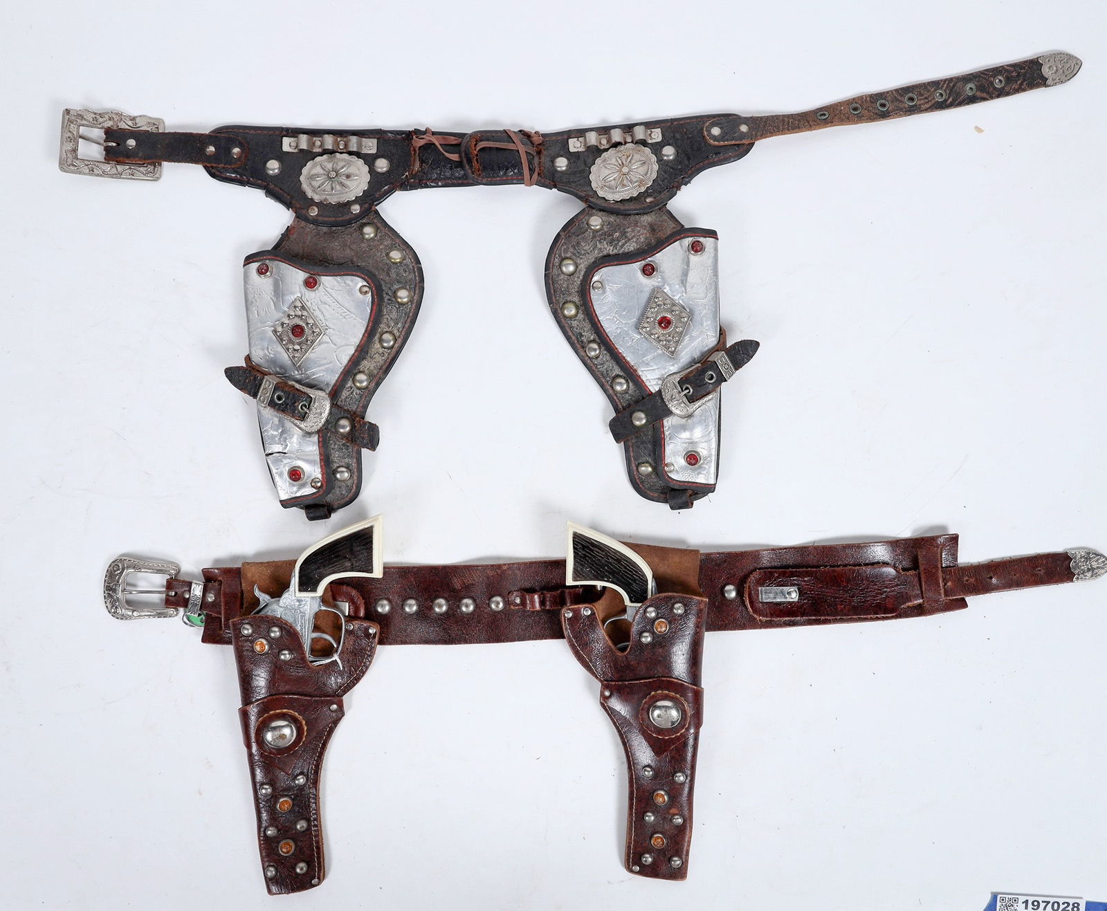 Hubley Pistols in Gorgeous Holster, with Bonus Holster [197028]: Hubley toy pistols in wild west leather holster. White and brown faux wood plastic handles with metal body gun. Pulling the trigger makes a small bang. Both guns are in good condition; see photo. The