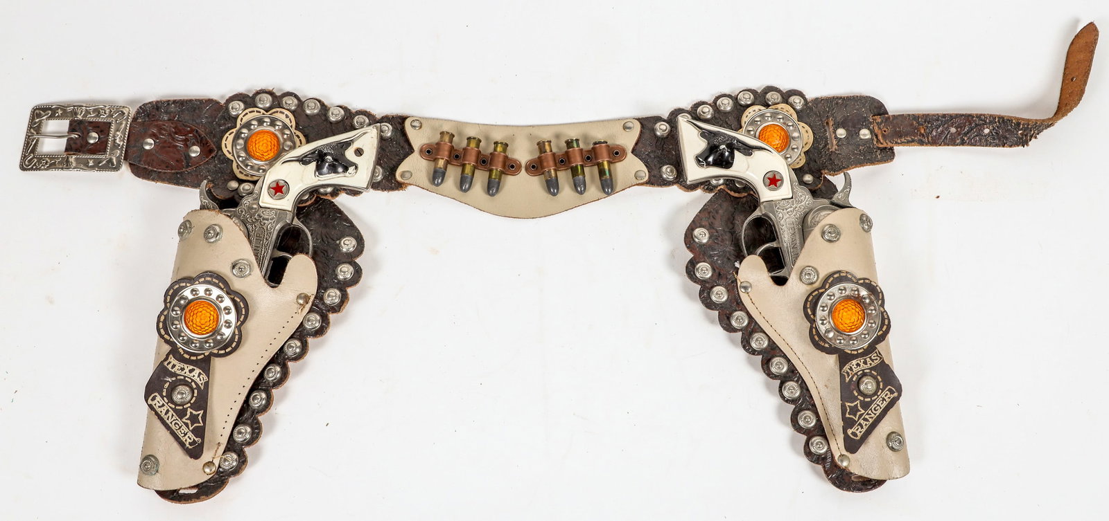 Hubley "Texas Jr" Texas Ranger two cap guns and Holster Rig [196969]: This is a two gun cap pistol set made by Hubley marked "Texas Jr" cap pistols with a two tone leather holster and gun belt. The holsters have yellow reflector conchos marked "Texas Ranger". It also ha