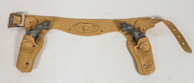 Two Hubley "Tex" cap pistols with rubber Holsters and Belt Set (2) [196976]