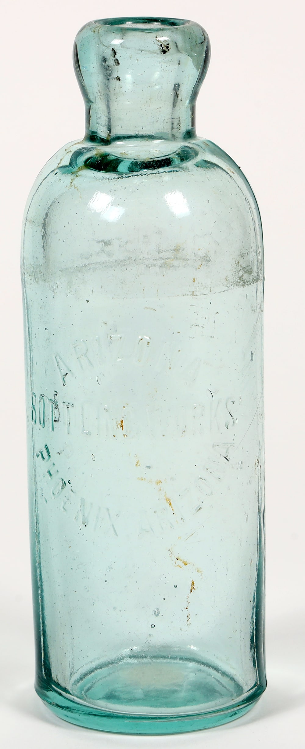 Aqua Hutchinson Soda, Arizona Bottling Works [194136]: Aqua Hutchinson Soda bottle from the Arizona Bottling Works. 7" tall. Front reads "ARIZONA / BOTTLING WORKS / PHOENIX, ARIZONA". Bottom reads "329 / H". Beautiful color.^Date: Country (if not USA):Sta