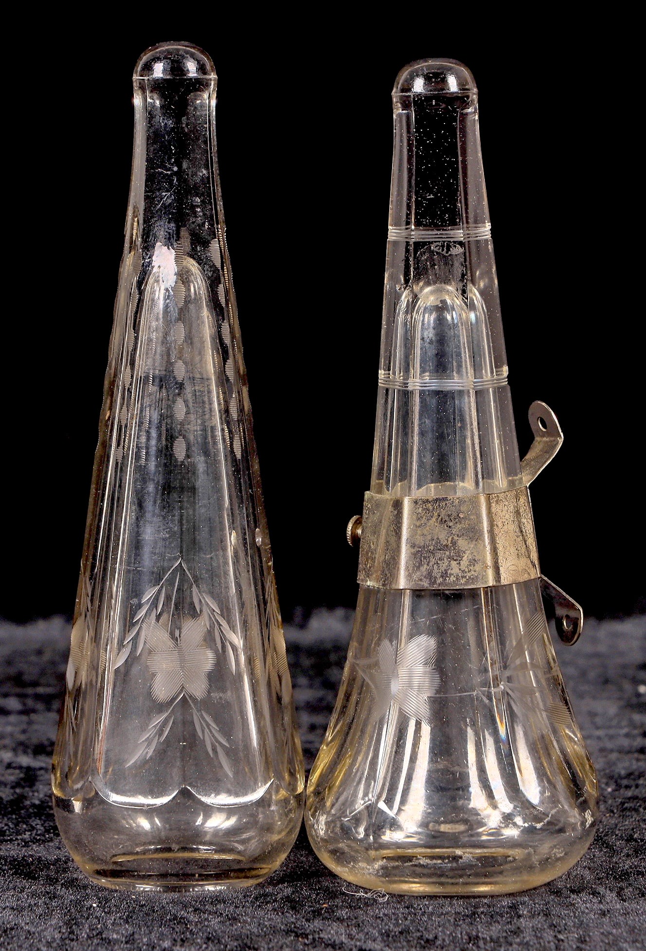 Car Vases, Same Shape Pair, Different Pattern [195835]: 2 8" inward lip car vases in the same shape, 1 is a vertical pattern, the other is horizontal. 1 bracket.^Date: Country (if not USA):State: City: Provenance: Mike Polak "Bottle King" CollectionPLEASE