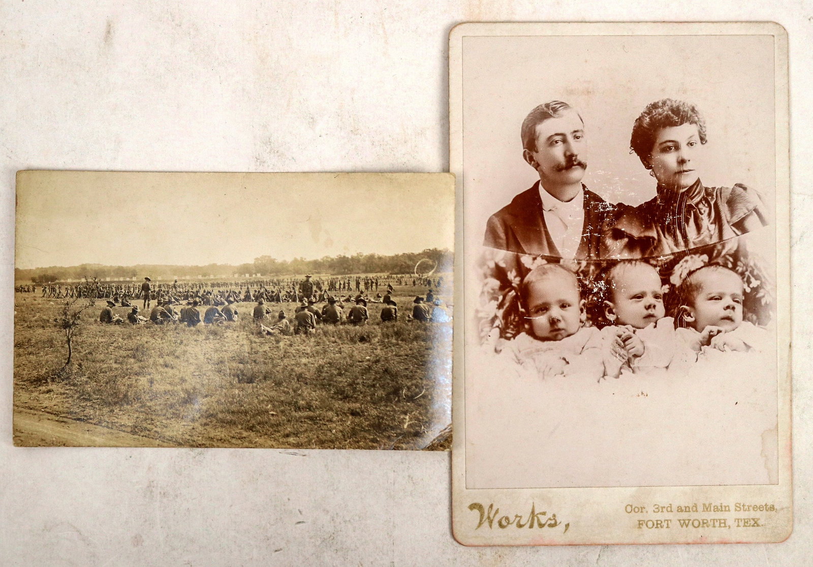 Leon Springs, Texas RPPC and Forth Worth Cabinet Card of Triplets [192881]: Lot of 2. 1) Cabinet card showing parents and triplets. Photo by Works, Forth Worth, Texas, taken in 1896 (text on back). Staining, water damage. 2) Real photo postcard showing soldiers(?) or cowboys 