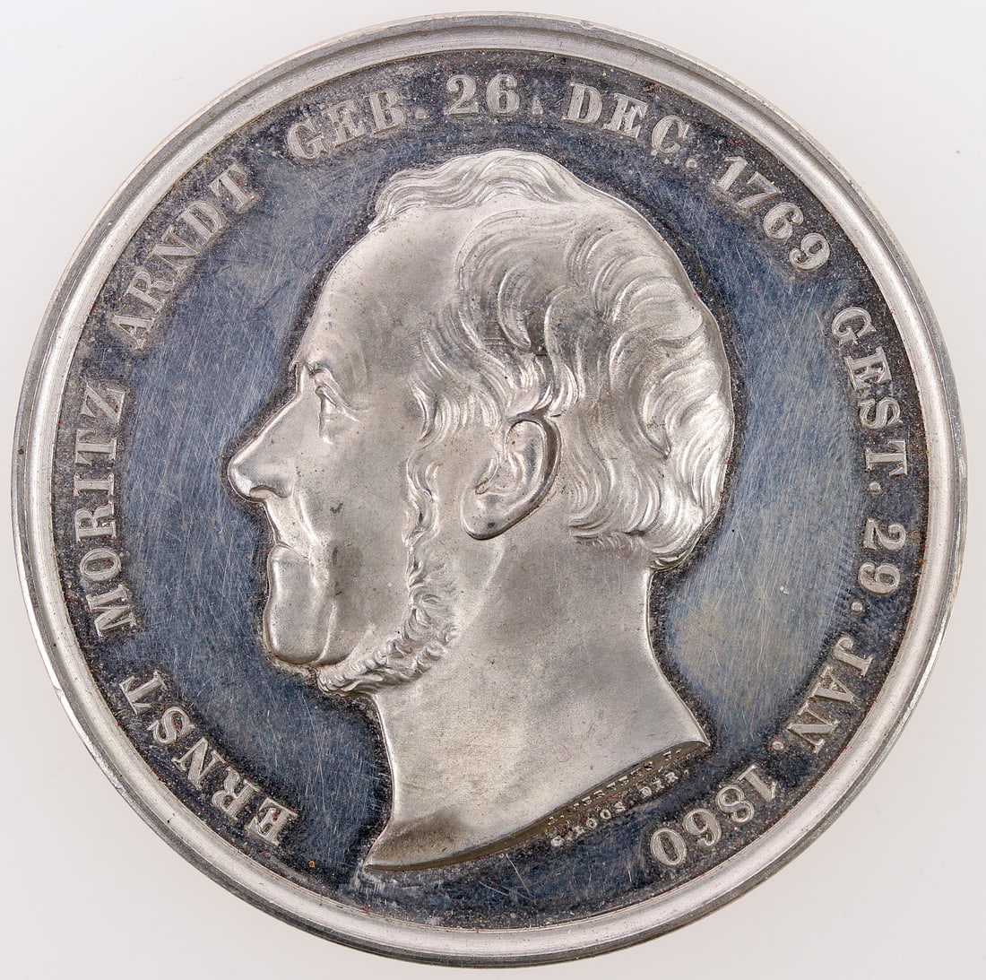 Ernst Moritz Arndt Medal in Original Box [196280]: White metal 2" Ernst Moritz Arndt medal in original box with some box damage.^Date: 1865Country (if not USA):State: City: Provenance: PLEASE NOTE: We assume lots have been viewed in person and/or cond