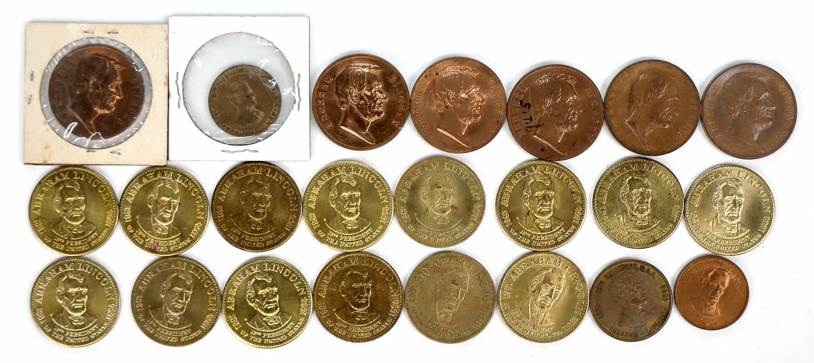 Lincoln Presidential Medals, (24) [195806]: About 24 Lincoln brass and copper medals.^Date: Country (if not USA):State: City: Provenance: PLEASE NOTE: We assume lots have been viewed in person and/or condition questions have been asked before b