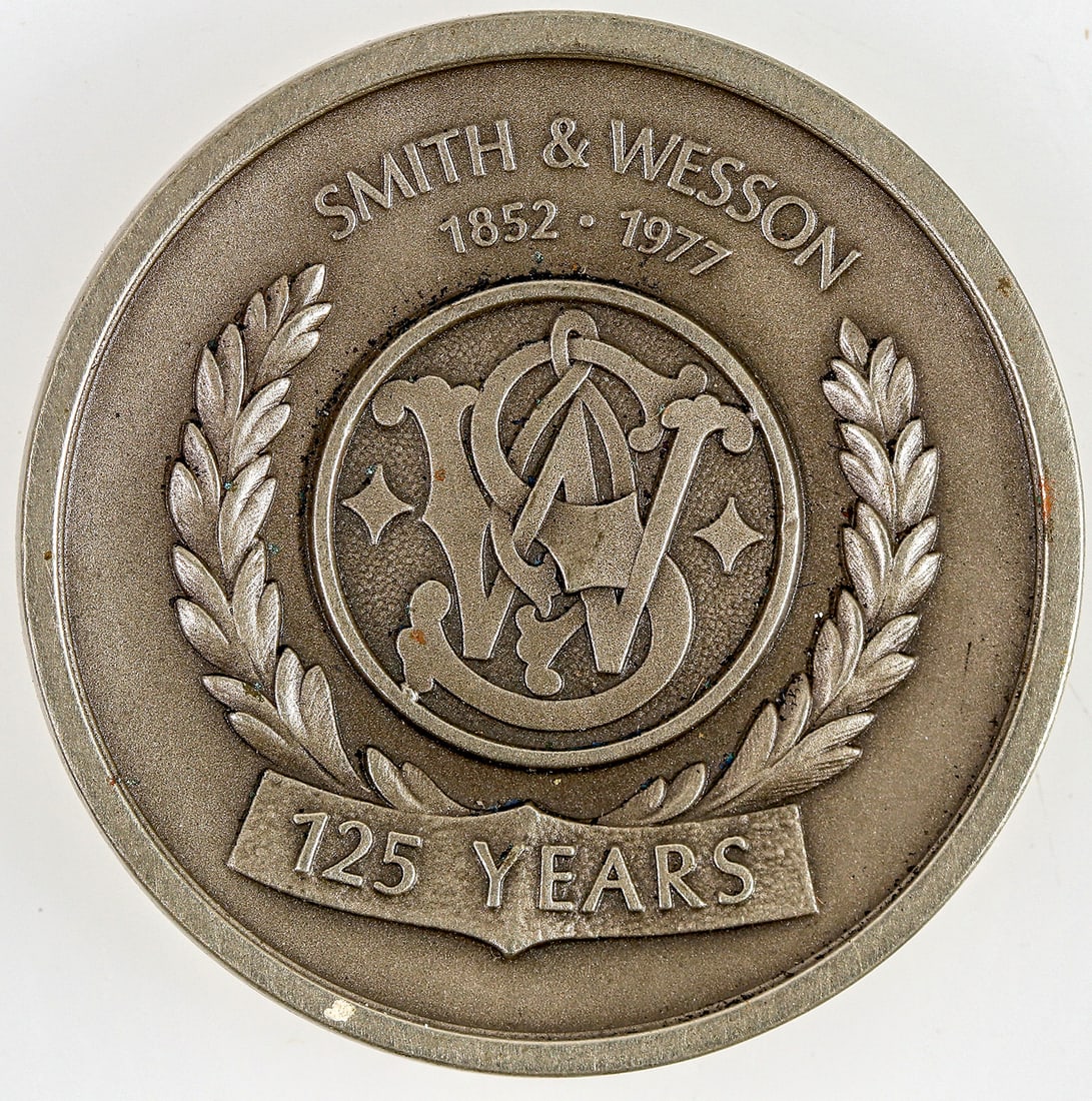 Smith & Wesson Medal, 1977 [195829]: 1977, 125 year anniversary medal. 1.5" white metal.^Date: Country (if not USA):State: City: Provenance: PLEASE NOTE: We assume lots have been viewed in person and/or condition questions have been aske