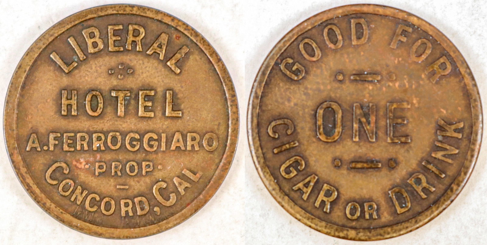 Liberal Hotel Token [194947]: LIBERAL / HOTEL / A. FERROGGIARO / PROP / CONCORD, CAL. / / GOOD FOR / ONE / CIGAR OR DRINK; Br., rd., 21 mm.^Date: Country (if not USA):State: CaliforniaCity: ConcordProvenance: PLEASE NOTE: We assum