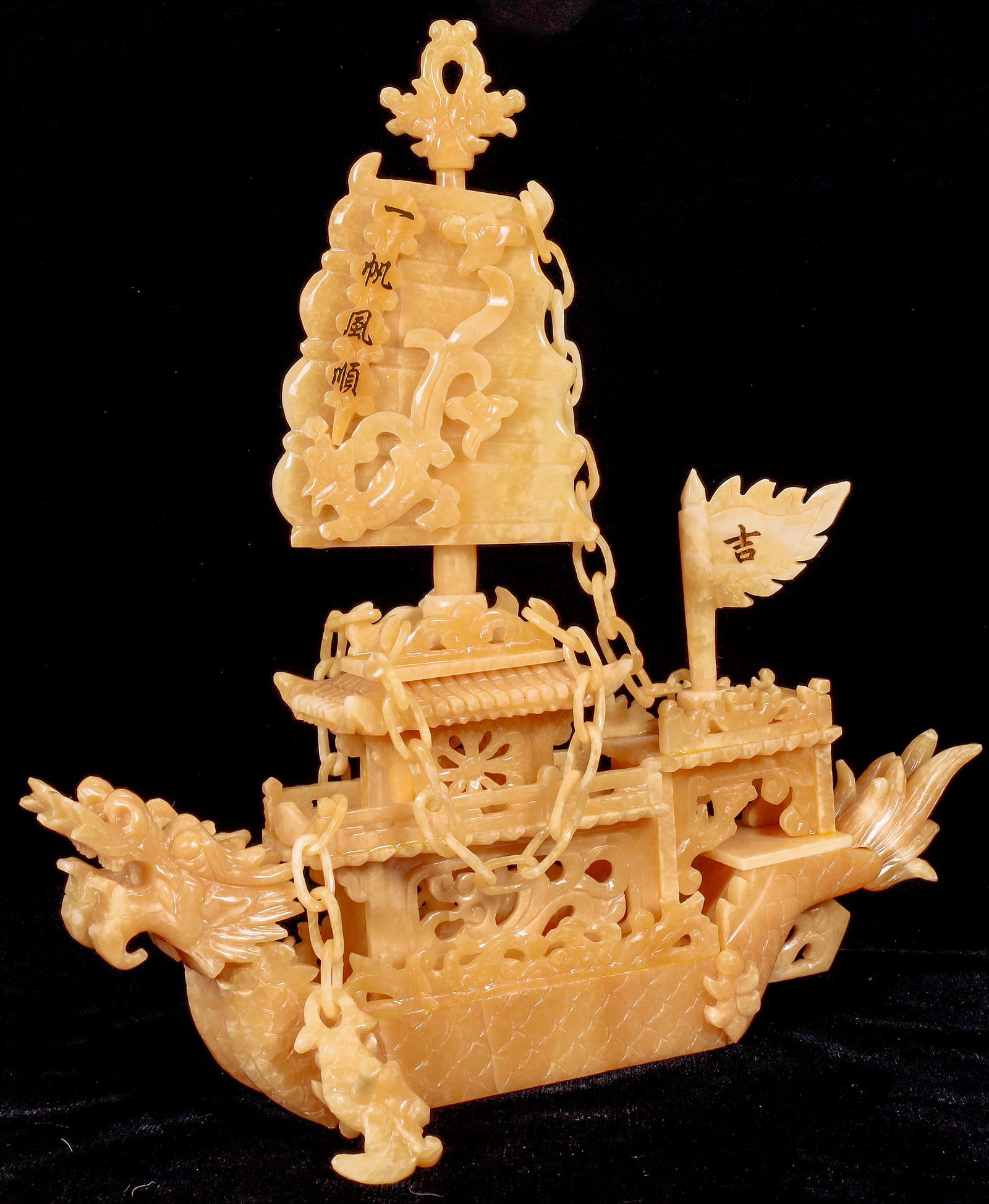 Chinese Dragon Boat, Yellow Onyx [175641]: Beautifully Hand-Carved Dragon Boat made from Yellow Onyx with varnished, ornate wooden stand in excellent condition. Golden Chinese print on sails "Lucky" & "Smooth Sailing". In Chinese Culture it's