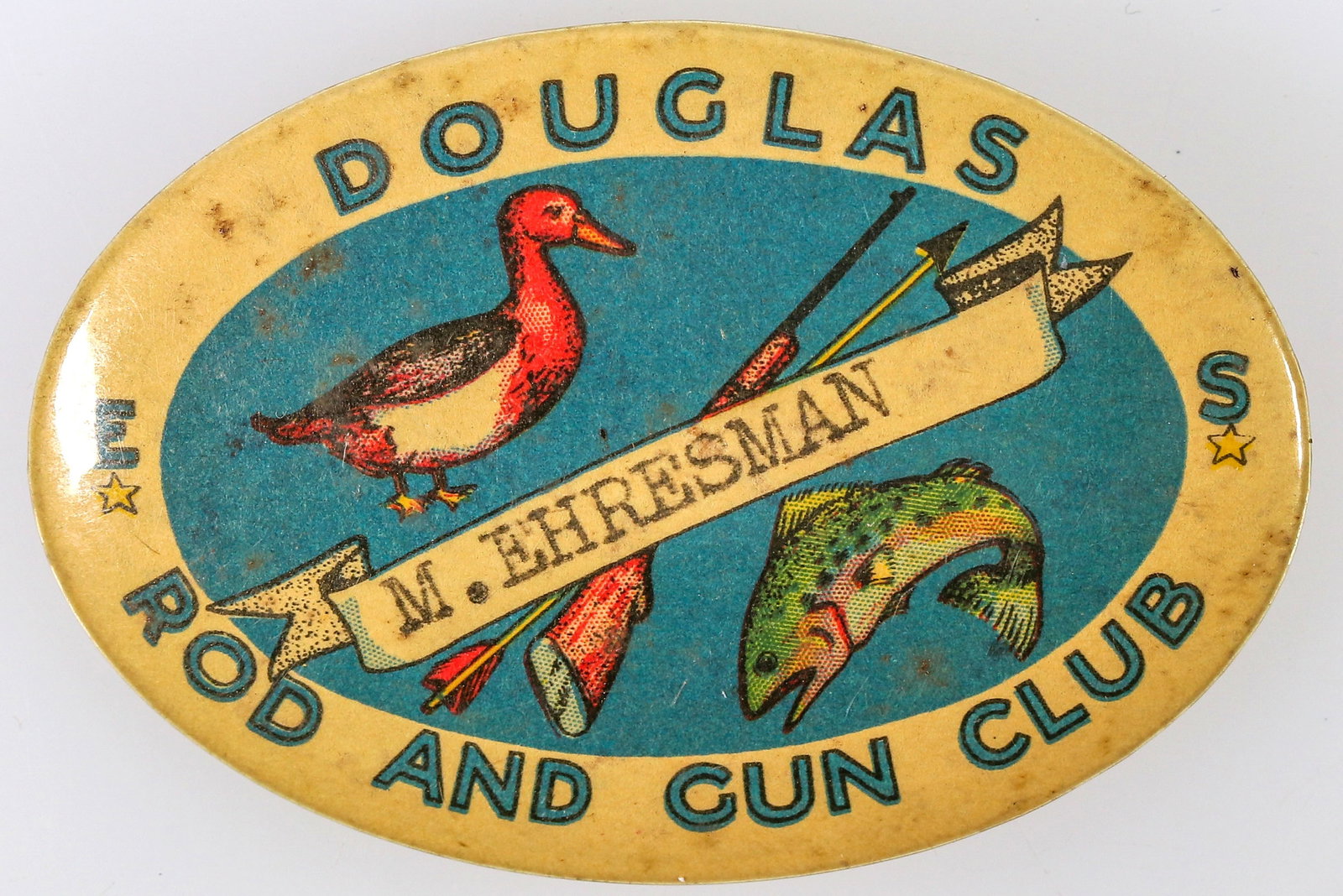 Douglas Rod and Gun Club Pinback [196302]: This pinback is for the Douglas Rod and Gun Club; likely from Nevada, or California. Oval shaped at 1.5 inches across. It was assigned to "M. Ehresman". In very good condition.^Date: Country(if not US