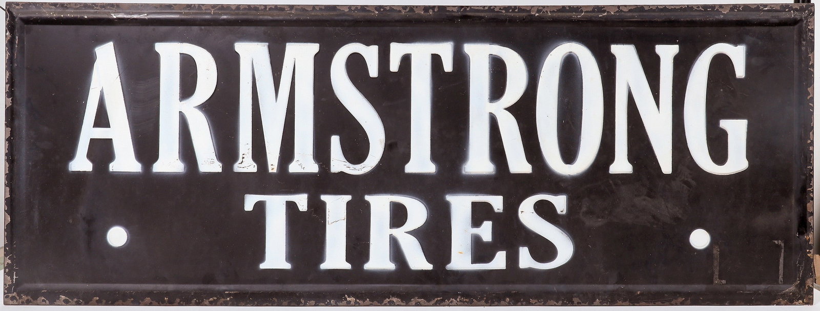 Armstrong Tires Advertising Sign [196473]: Metal advertising sign reproduction: black with white lettering "ARMSTRONG TIRES." 48 x 18 inches. Armstrong Tires was founded in 1912 by George F. Armstrong in a small New Jersey loft. By the early 1