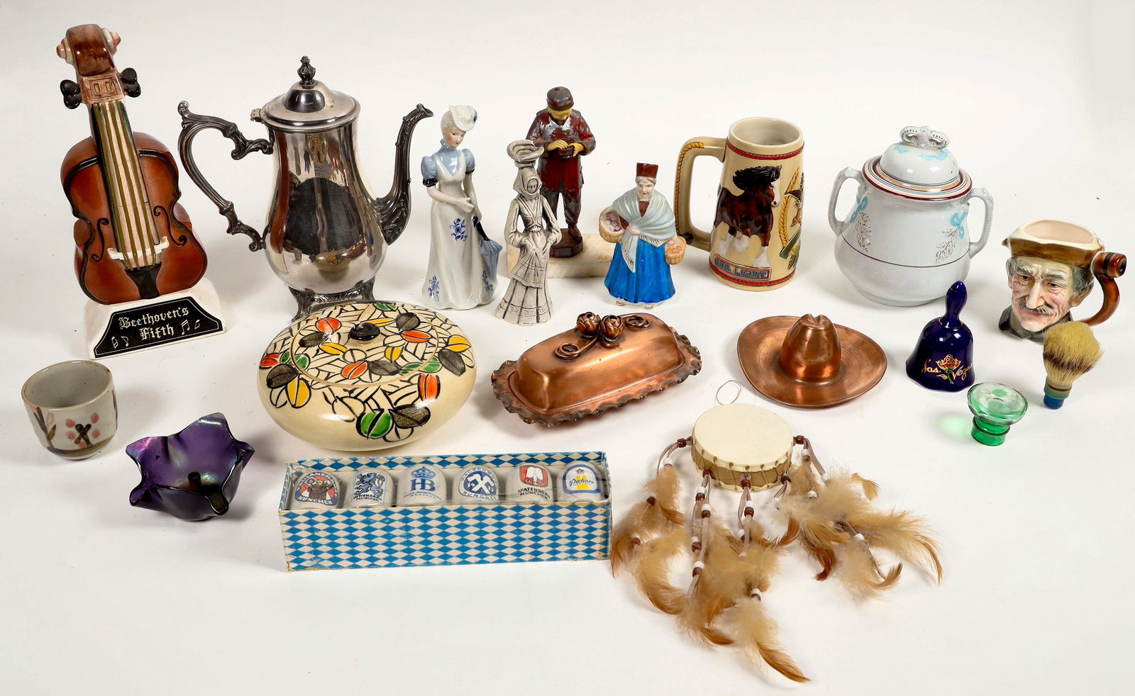 Figurines, Kitchenware, Tchotchkes Grab Bag [197349]: A grab bag of miscellaneous items including figurines, ceramics, metal kitchenware, and novelties. Some notable items include a ceramic music box/functional bottle in the shape of a violin which plays