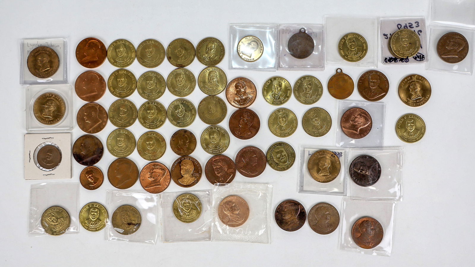 Post WWII Presidential Medals, 1953-2000 (57 Medals) [195735]: Lot of 57. 1953-2000. Includes Eisenhower (20), John F. Kennedy (19), Johnson (9), Nixon (5), Carter (3), and Reagan (1). Please inspect.^Date: 1953-2000Country(if not USA): State: City: Provenance: