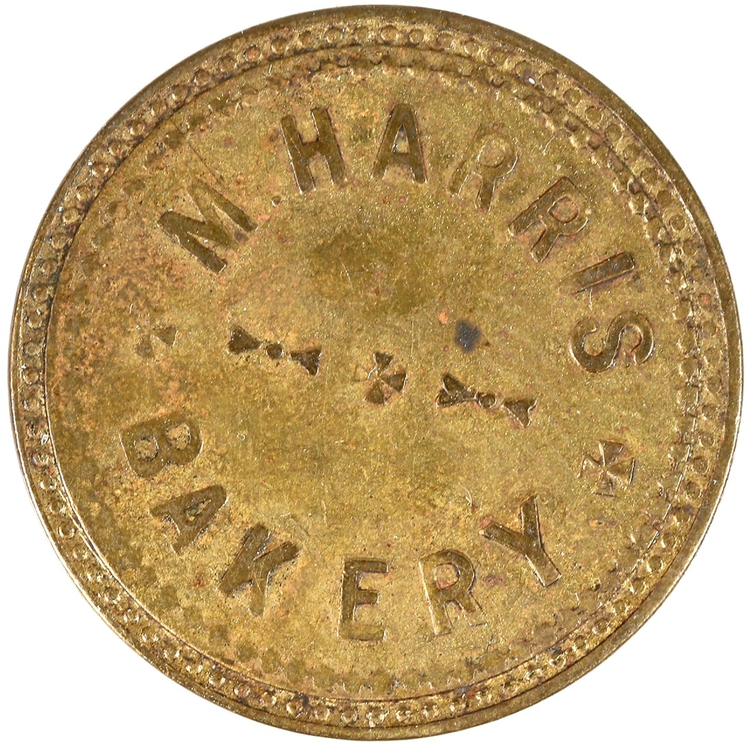 N. Harris Token [192524]: M. HARRIS / BAKERY // GOOD FOR / ONE / LOAF OF BREAD; Br., rd., 25 mm.^Date: Country(if not USA): State: NevadaCity: GardnervilleProvenance: