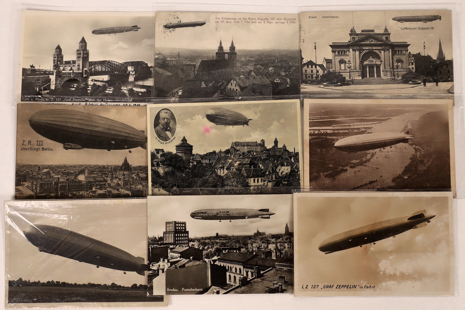 Zeppelin Postcards (8) [199700]: Lot of 8 B/W postcards of the Graf Zeppelin III and LT 127. Street, aerial, and rooftop views of Zeppelins over German cities and countryside. One has a photo of Dr. Hugo Eckener, commander of the Gra