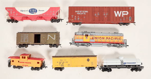 Union Pacific HO Diesel Engine W/Rail Cars [185715]: Lot of 7. Unk. Make (made in Yugoslavia), GP7 diesel with Union Pacific markings, nice detail. Never run, always on display. Rolling stock: Canadian National box,(weighted, some rust), Chicago Ill. Mi