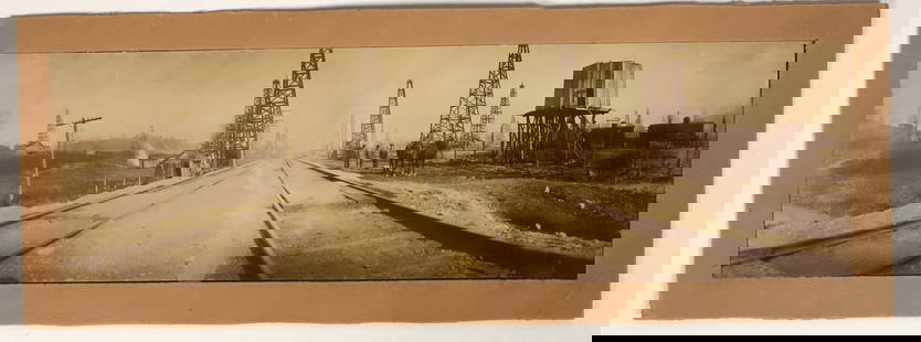 Early Oil Field Panorama Photograph (Possibly California) [197607]: Excellent early oil field panoramic photo with horse-drawn wagon, oil derricks, and oil tanks in view. Reverse has pen notation that this is Ventura, California. We cannot verify this id. 3.5 x 11.5"