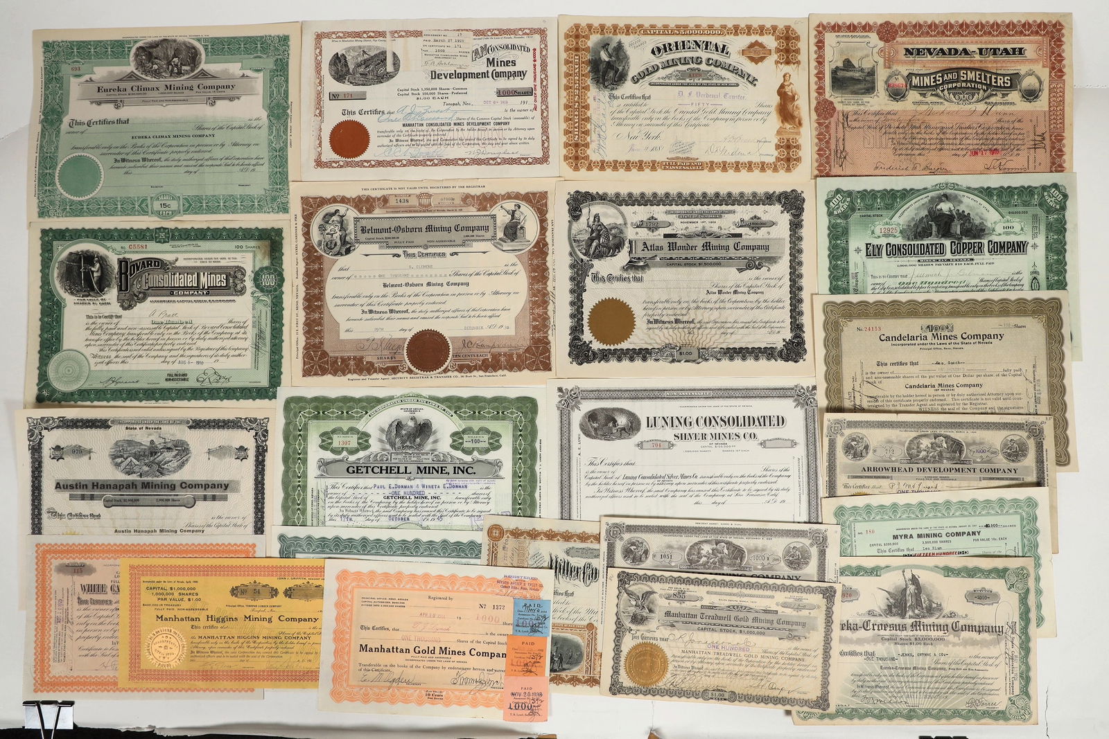 Central Nevada Mining Stocks [200193]: Lot of 22. U/U, I/U, I/C. Issued 1882-1945.Twelve different companies. I/E.; Getchell Mine, Inc., Ely Consolidated Copper Co. Arrowhead Development Co., Miller Gold Mining Cob, Oriental Gold Mining Co