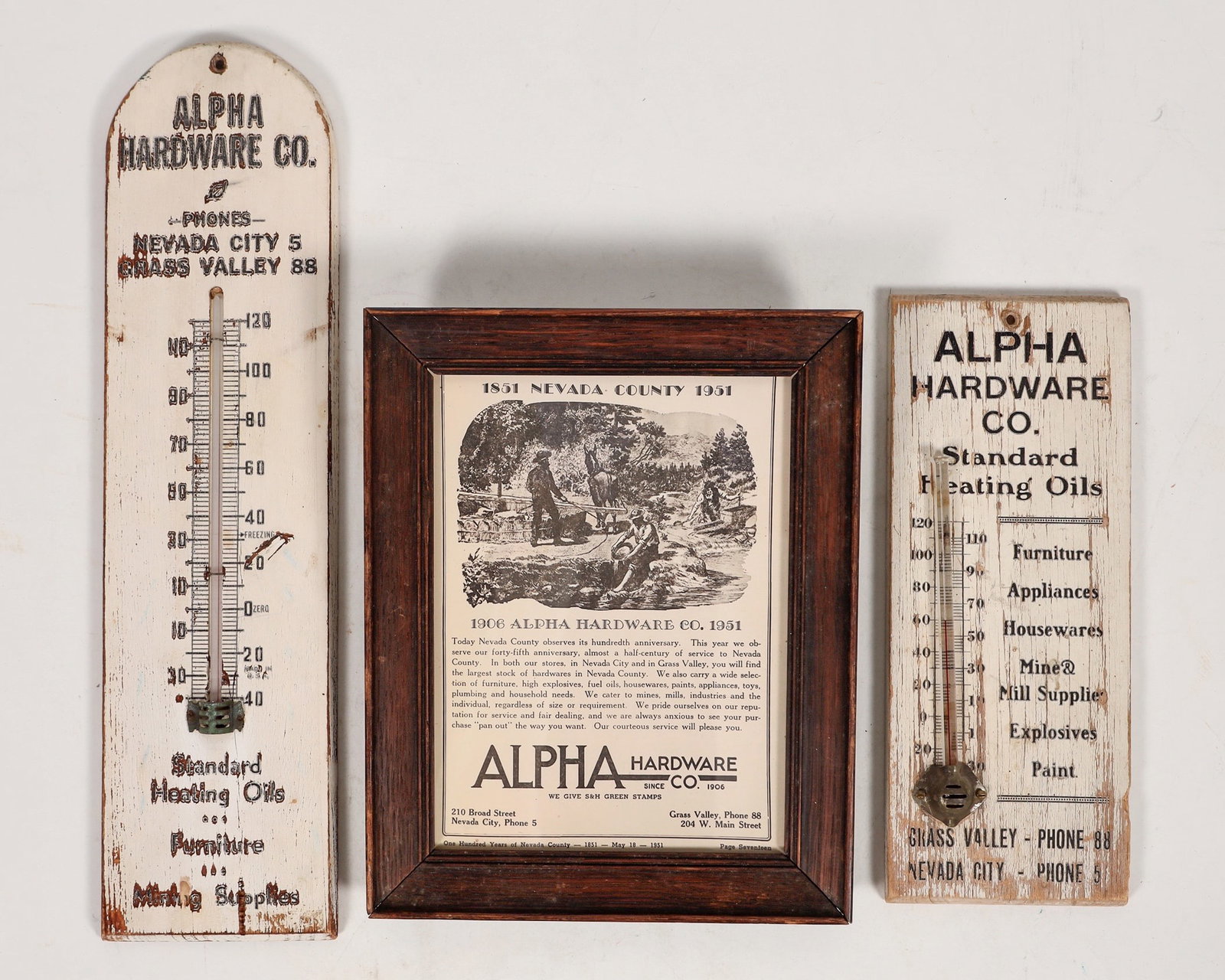 Alpha Hardware Co., Nevada City, Advertising Goods (3) [195079]: Group of 3 advertising pieces from Alpha Hardware of Nevada City. Includes 2 thermometers mounted on wood. First is 10" by 4", second is 15" by 4", both show wear from being mounted on an outdoor wall