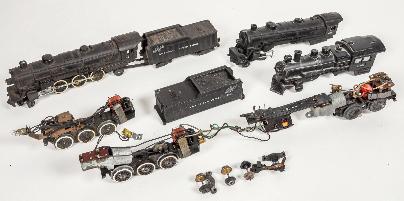 American Flyer Engine Parts and Bodies Parts [183883]: Lot of 8. One complete engine and tender #287, tested and motor hums, Graphis "Northwestern Chicago Lines", missing tender front trucks. Two locomotive bodies #21163 and 283. One tender body "Northwes