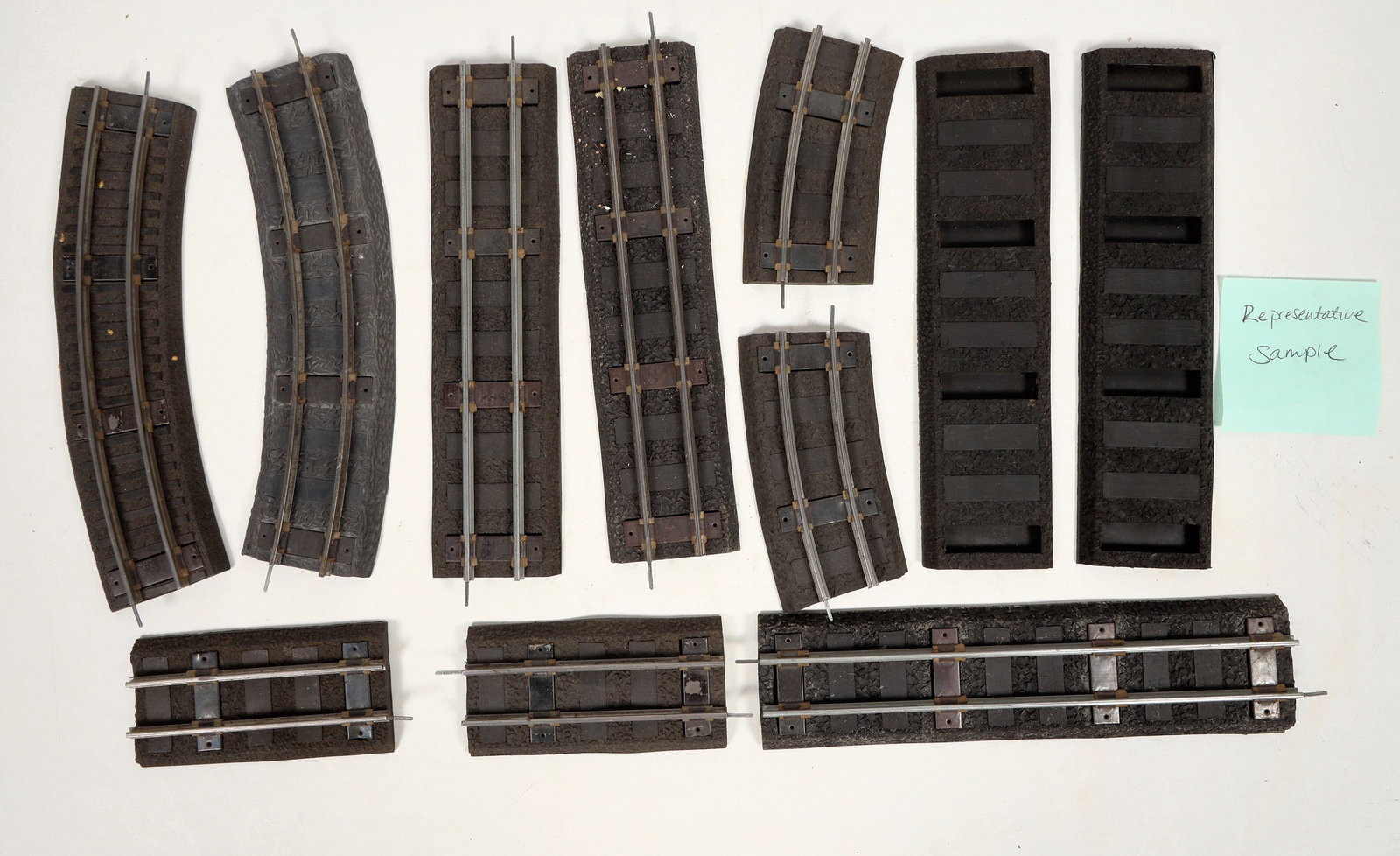 American Flyer S Gauge Rubber Roadbed And Track [183885]: Lot of 50+ American Flyer S gauge rubber road bed and track. 32+ curved, some are half sections. Five never used rubber straight sections, 12 used, 1 uncoupler, 1 re-railer. Conditions are good or bet