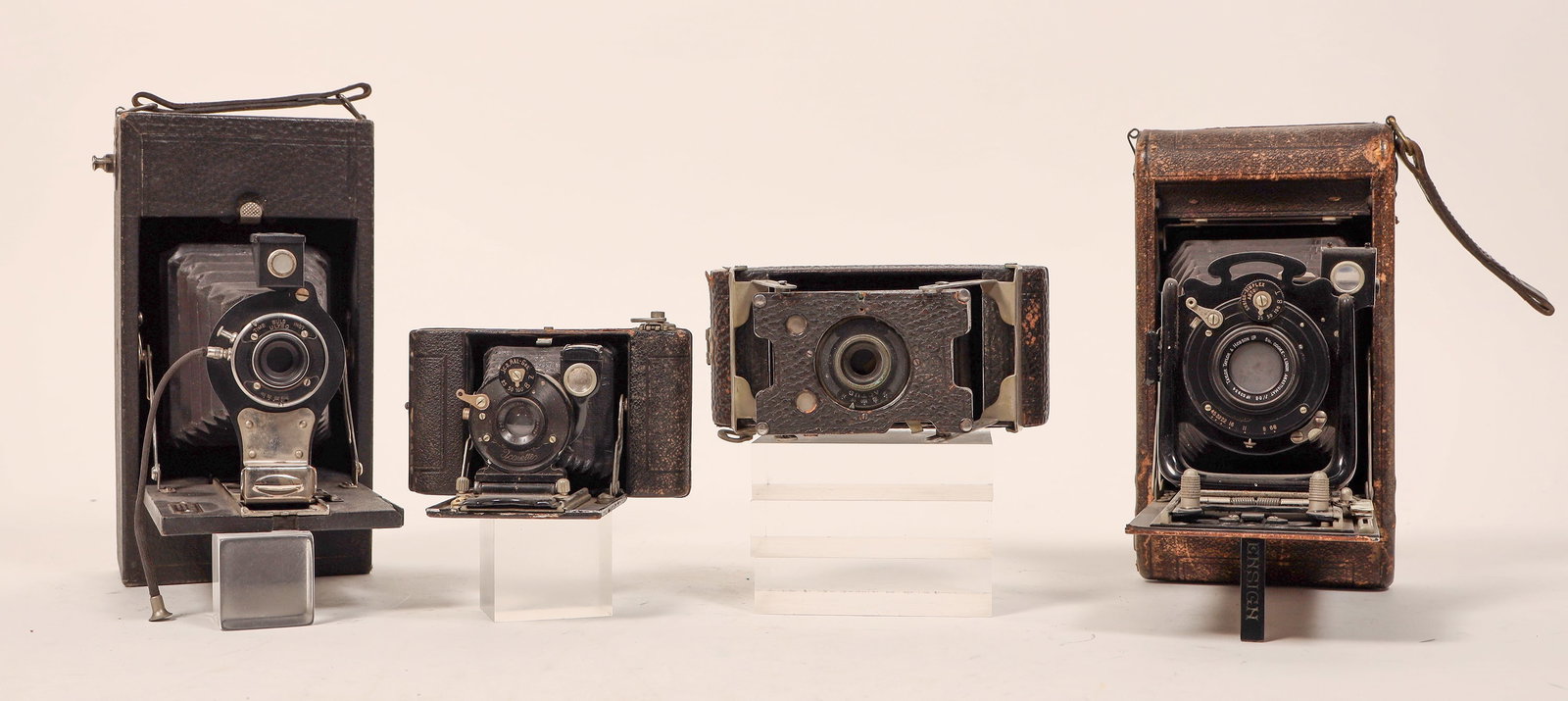Four Vintage Cameras [185537]: 4 vintage cameras. Actus with some leather loss. Icarette. Ensign. Conkley folding Kewpie. Not tested.^Date: Country (if not USA): State: City: Provenance: