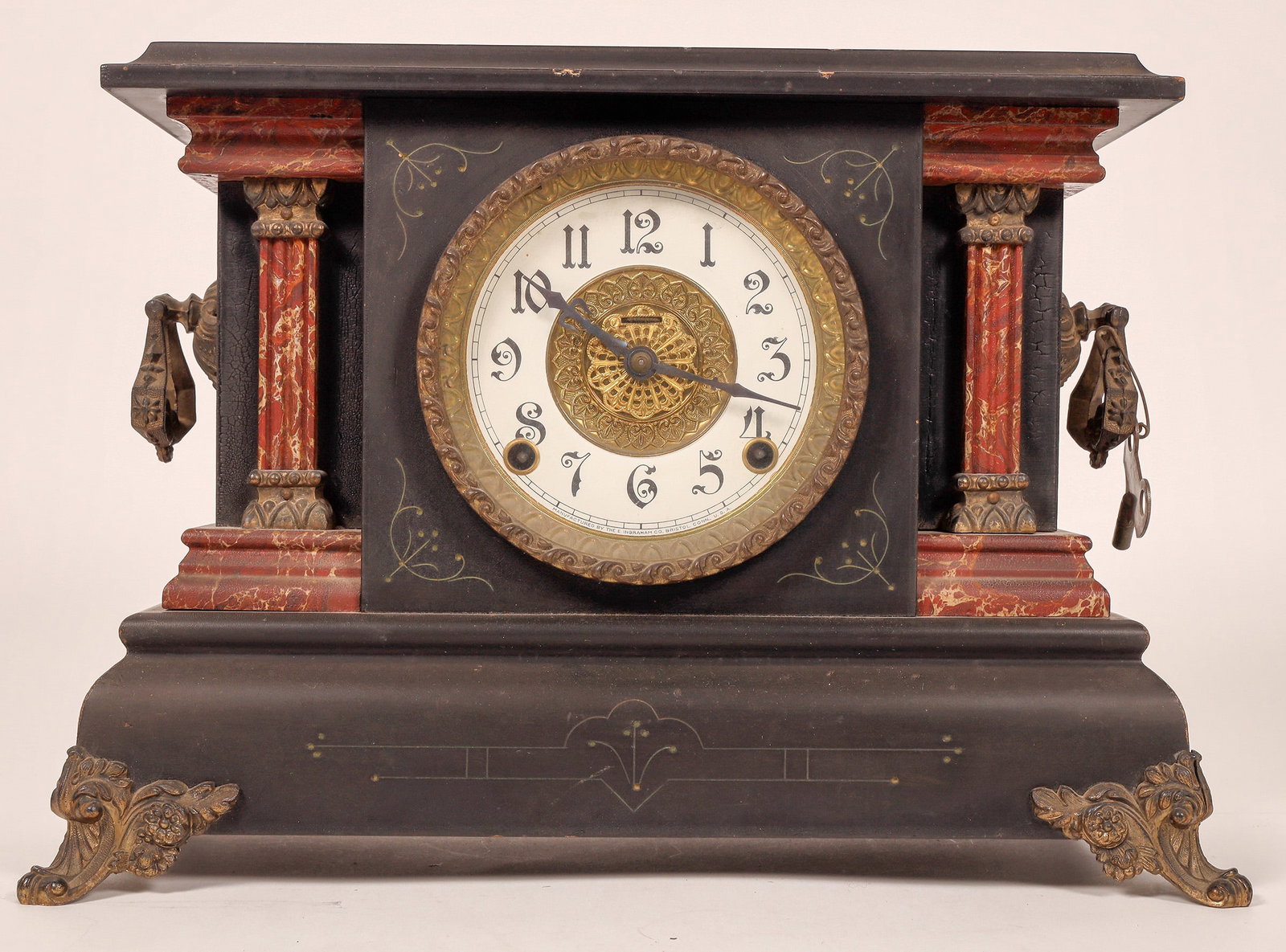 Ingraham Table Clock in Wood Case [181725]: Attractive E. Ingraham table clock in ornate wood case. 11x14x7". Includes winding key, missing pendulum. We tried a soft wind with the key and movement was not responding. Sold as is.^Date: Country (