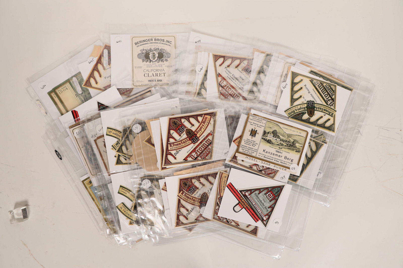 Germany - Wine Labels c1920s-30s (100+) [180595]: More than 100 wine labels from vintners in Germany, c1920s-30s. Wineries include: N. Fromm, Burgerspital, Scharzberger, Hoffman John, and more. Please see photo(s) for more details.^Date: Country (if